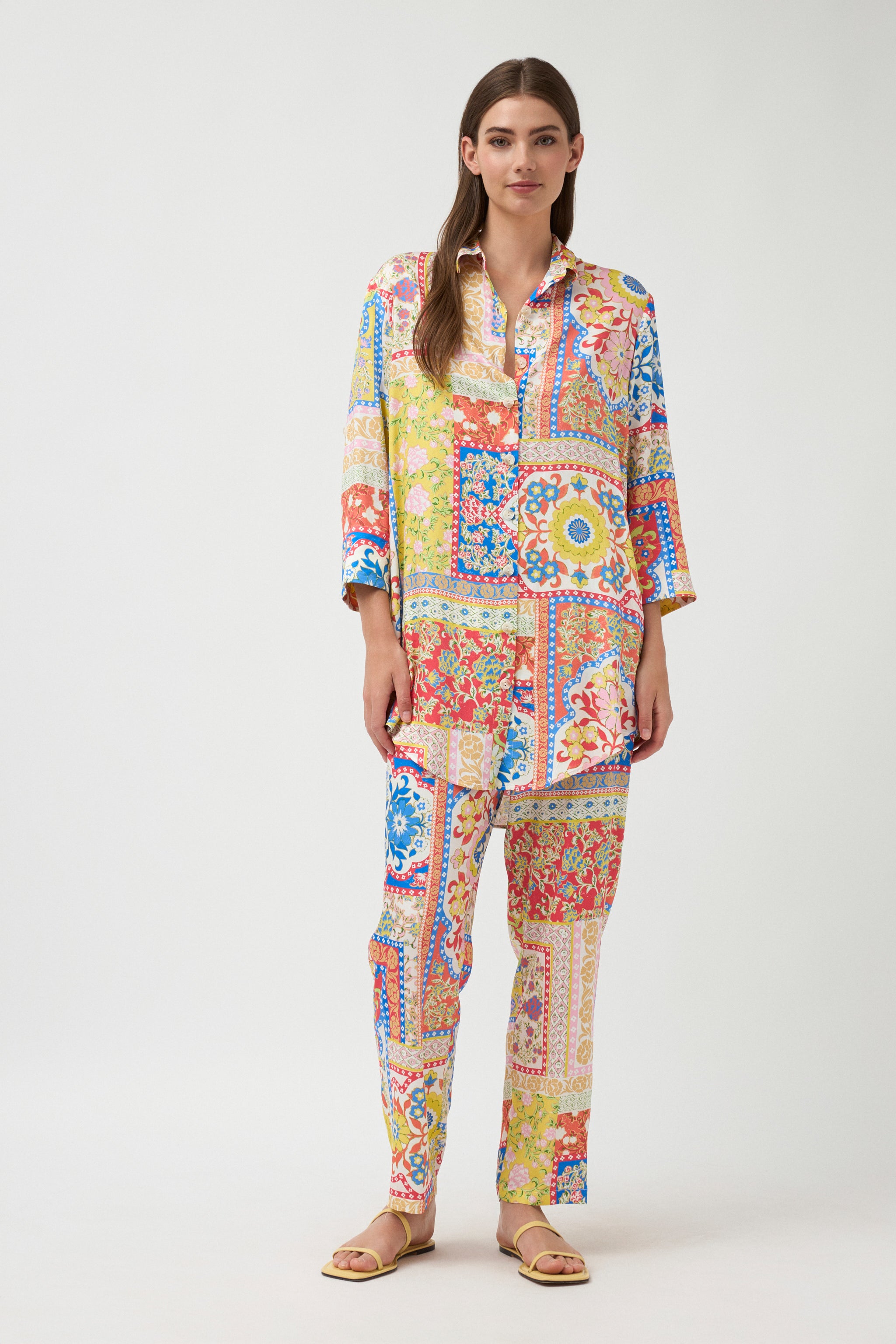 multi colour tile print shirt and pants worn by model