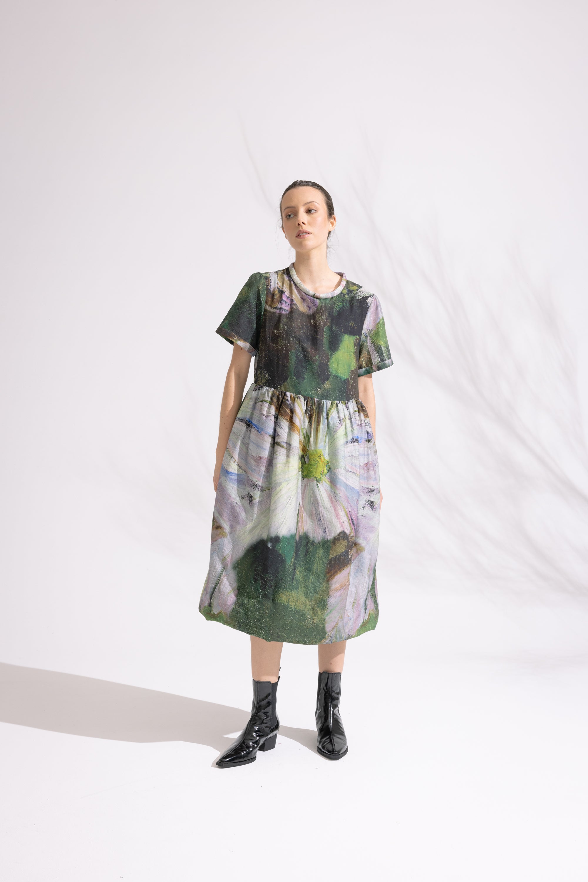 woman wearing patterned floral midi dress