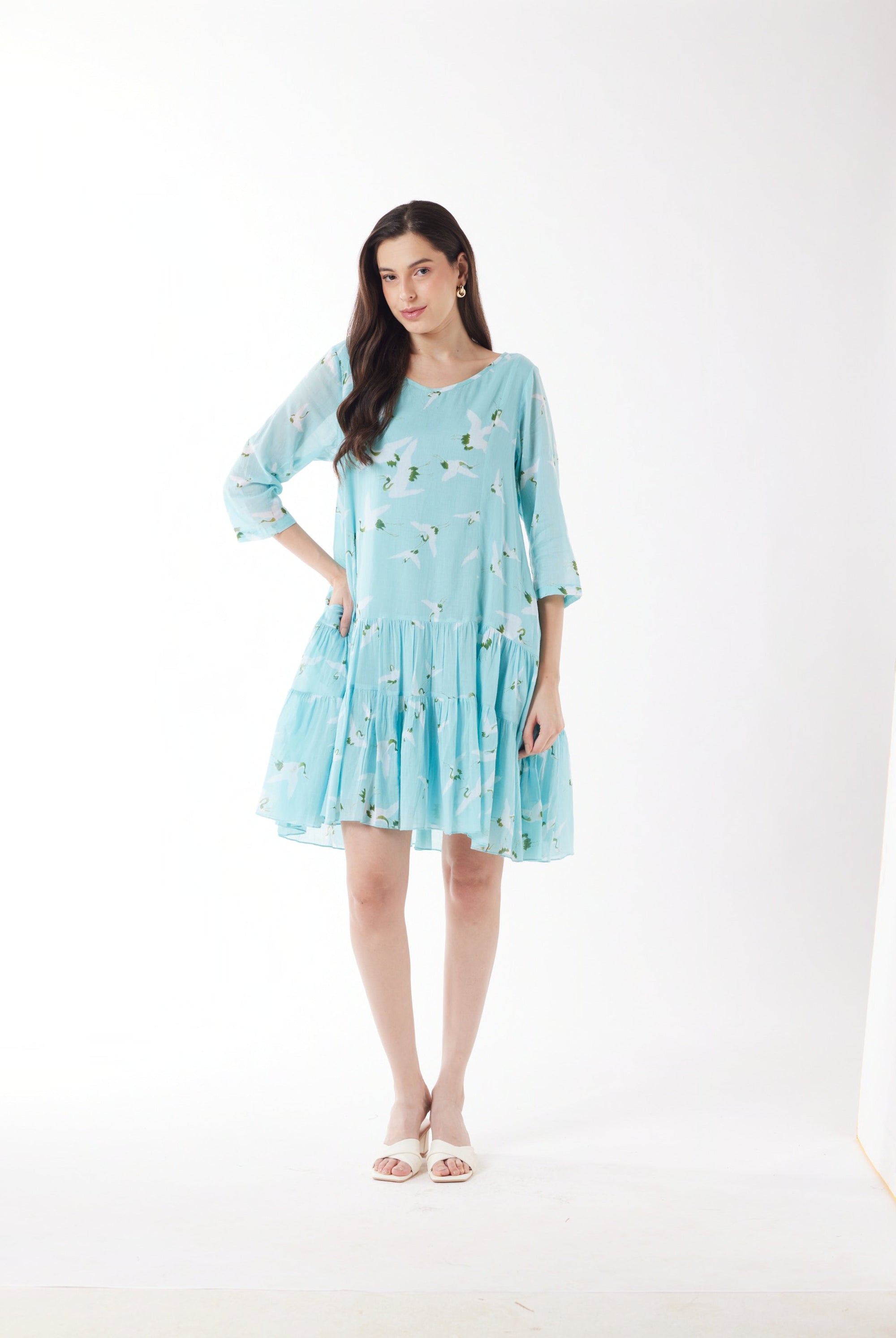 blue with white bird print midi dress worn by model