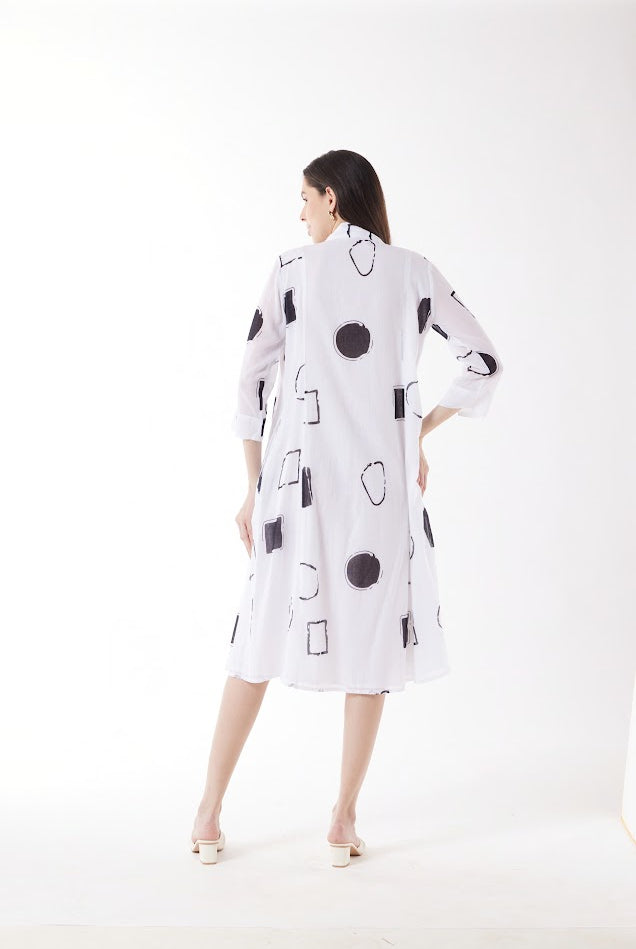 white midi dress with black geo print worn by model back view