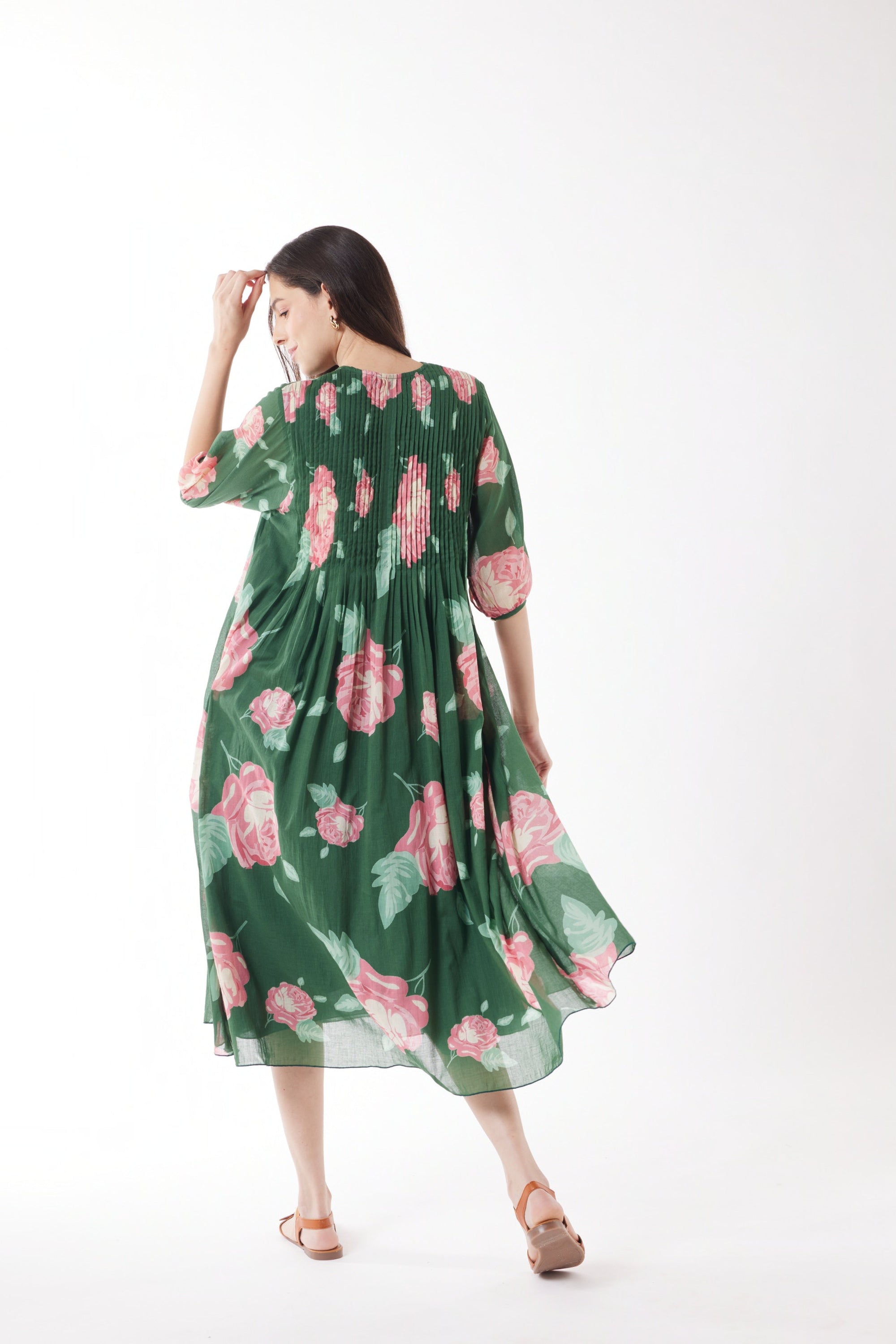 pleated midi dress emerald with roses worn by model back view