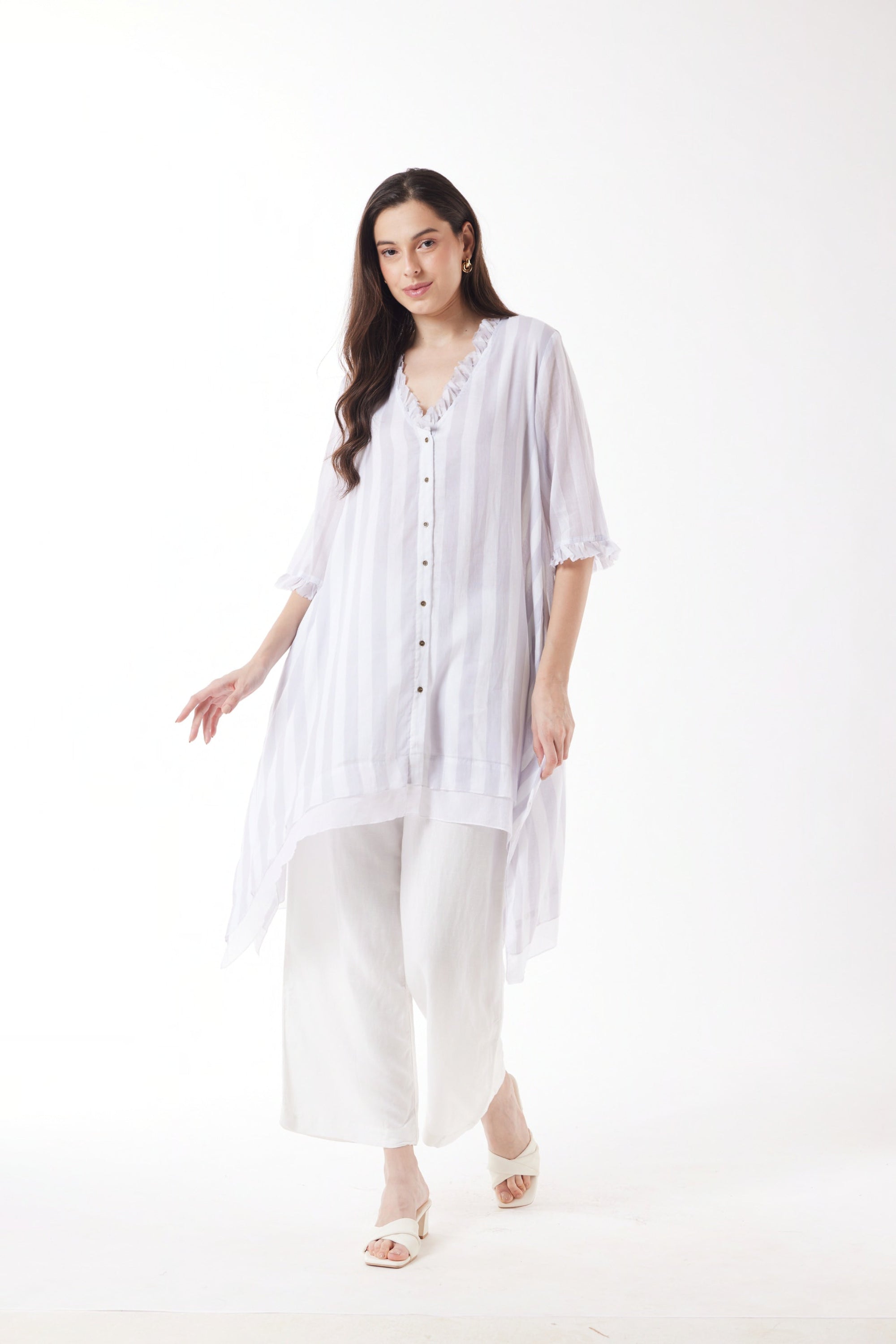 longline white grey stripe shirt and white pants worn by model