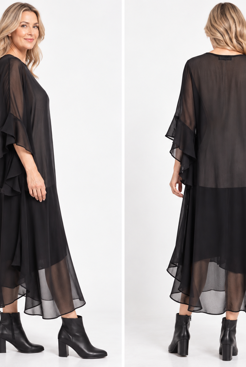A woman modeling a black sheer midi dress with layered ruffle sleeves and a flowing skirt, paired with black ankle boots, against a clean white studio background.