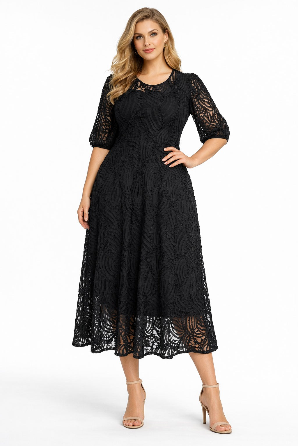 Woman wearing a black lace dress on a white background