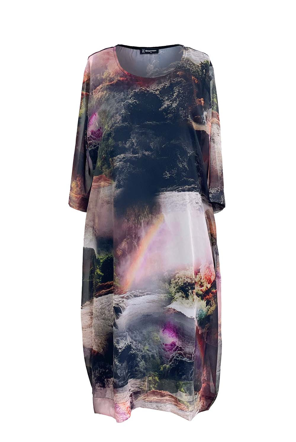 Multicolored dress with nature-themed print on a white background