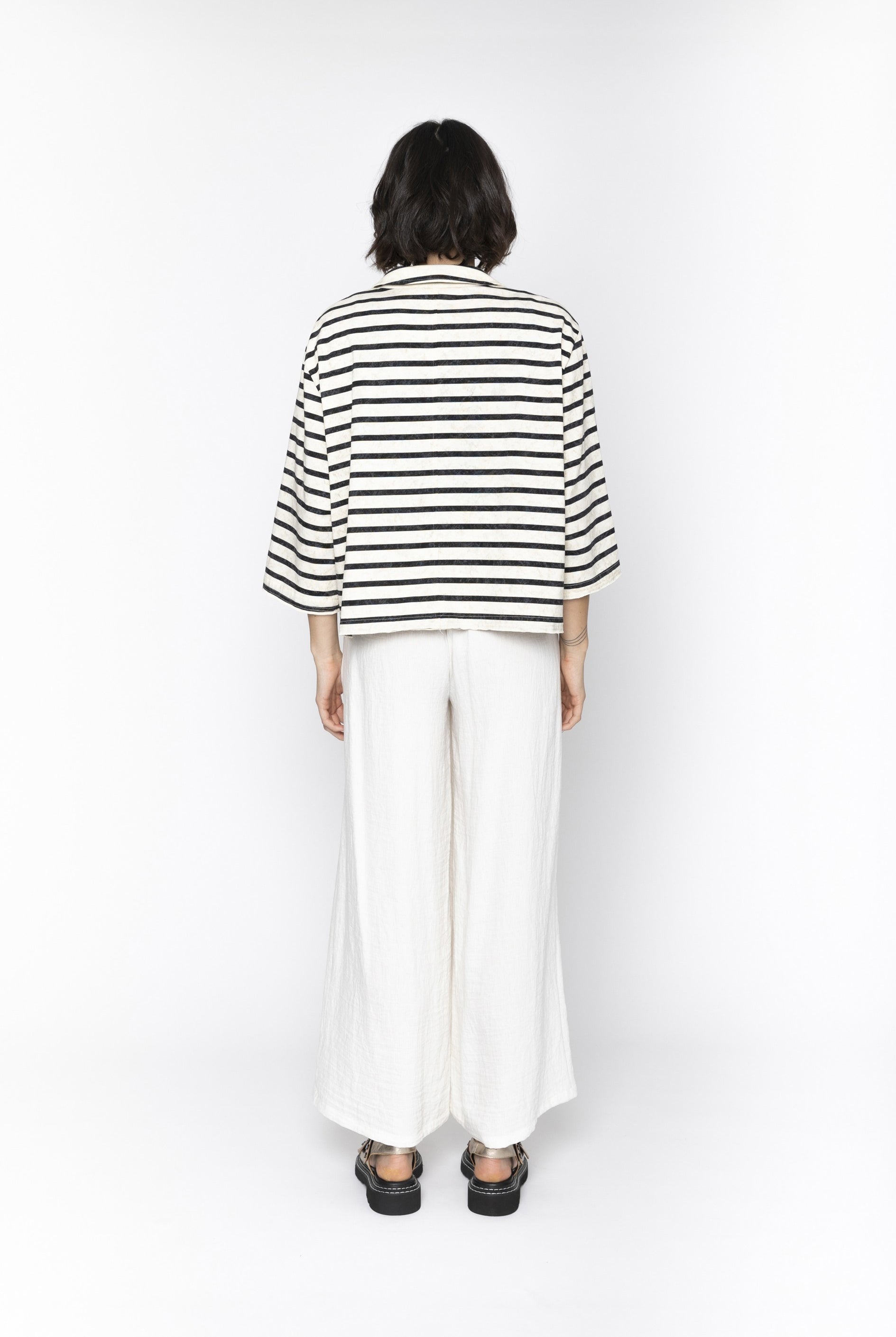 Womens white wide leg pants worn by model back view