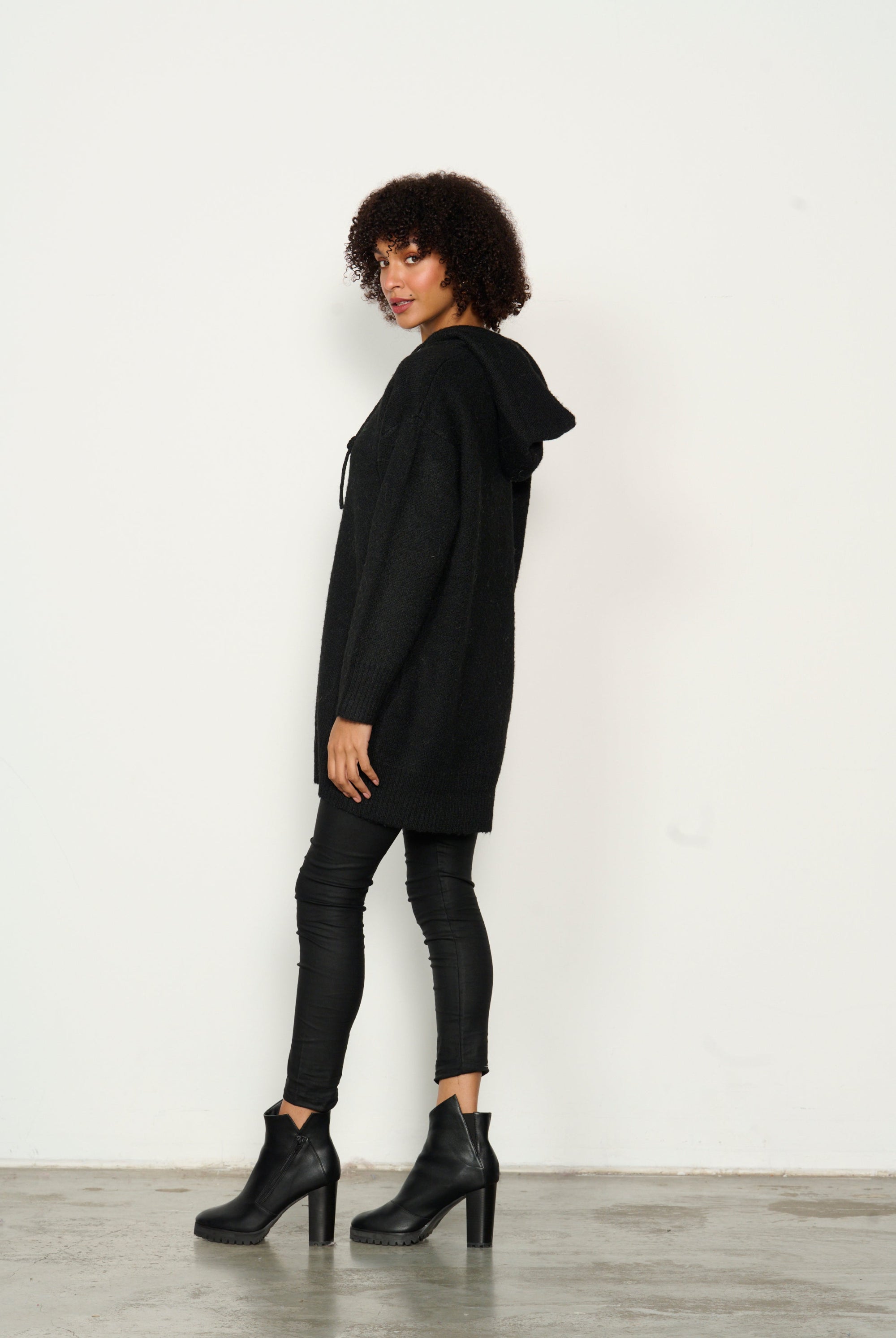 womens longline long sleeve hoodie in black worn by model side view