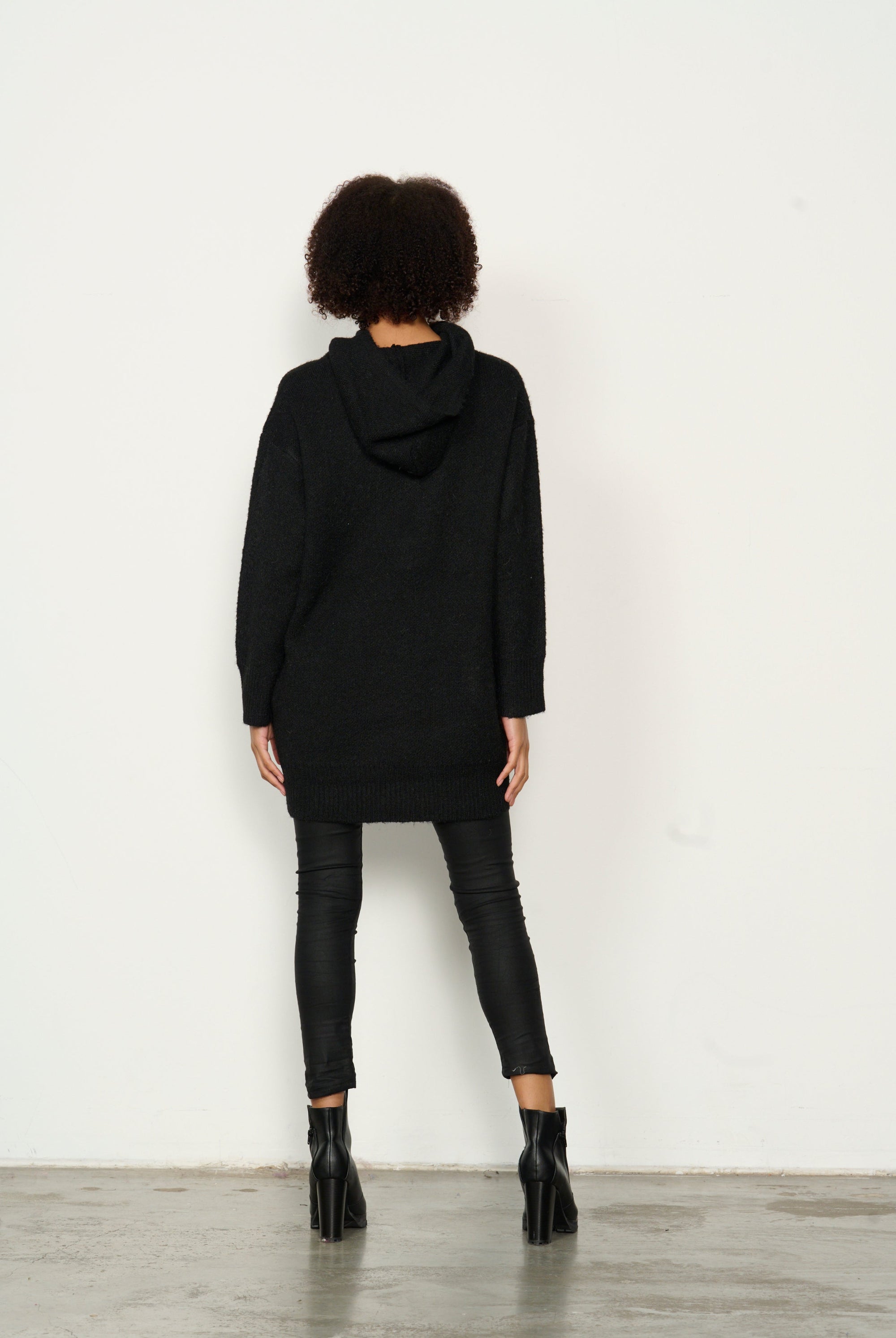 womens longline long sleeve hoodie in black worn by model back view