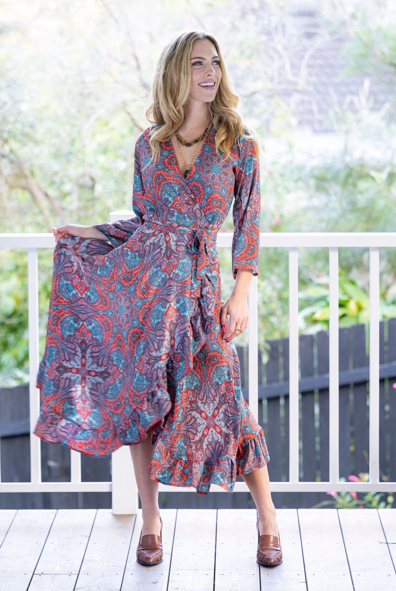 long wrap dress red blue paisley print worn by model