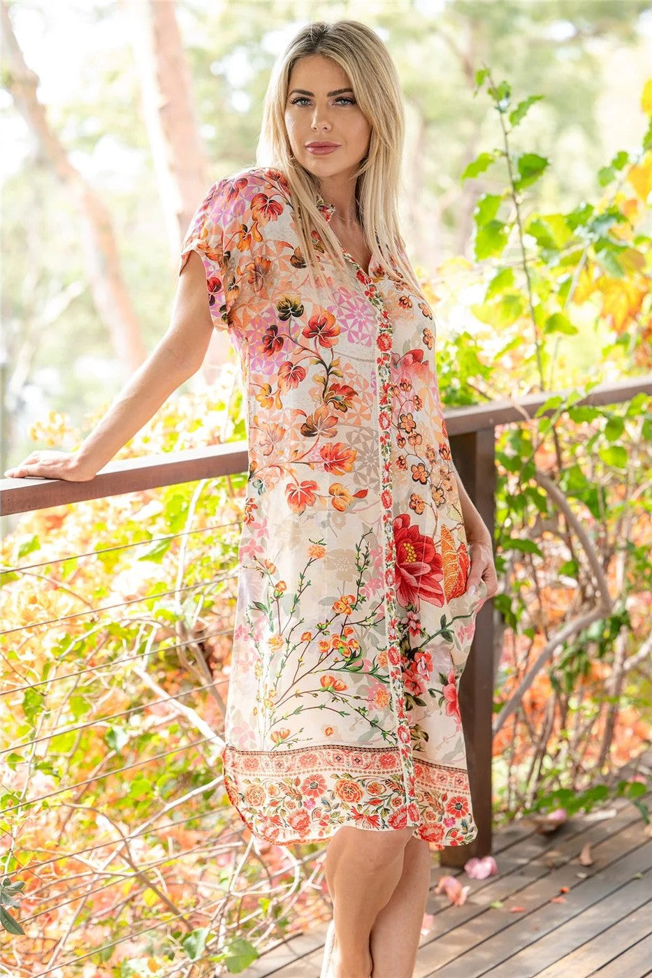 blush white floral dress worn by model outdoors