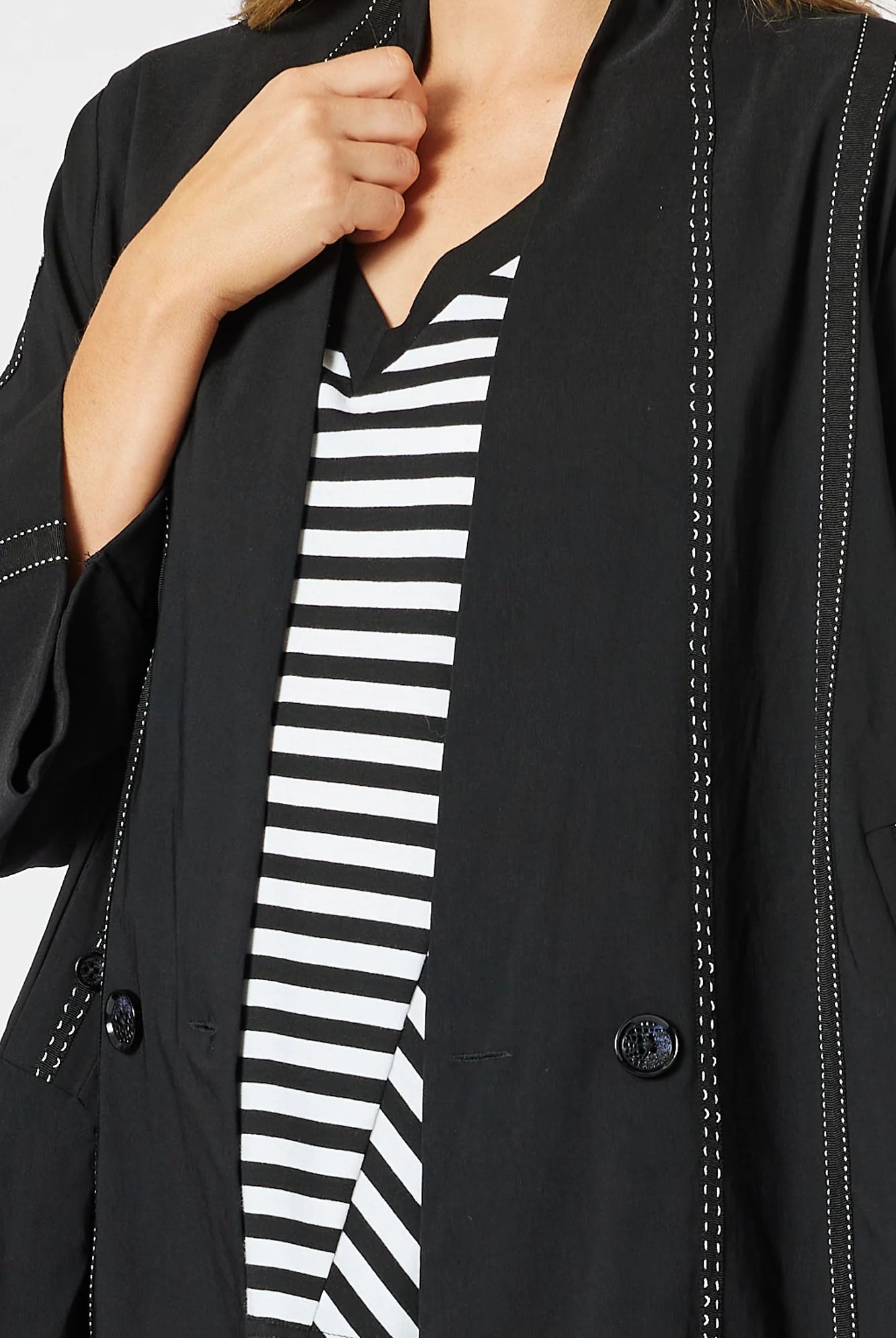 womens black jacket with white stitching details
