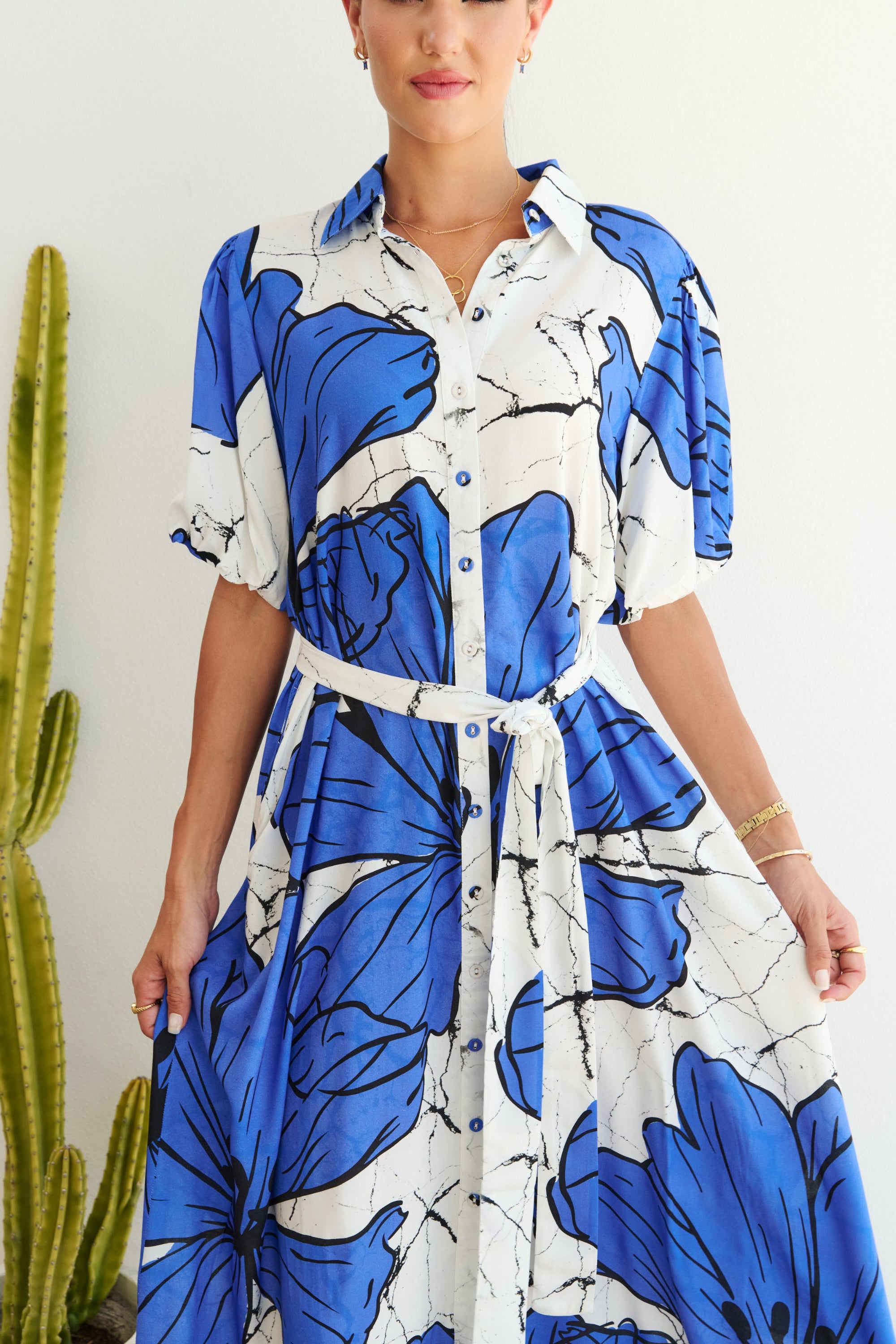 white blue large floral midi dress worn by model close up