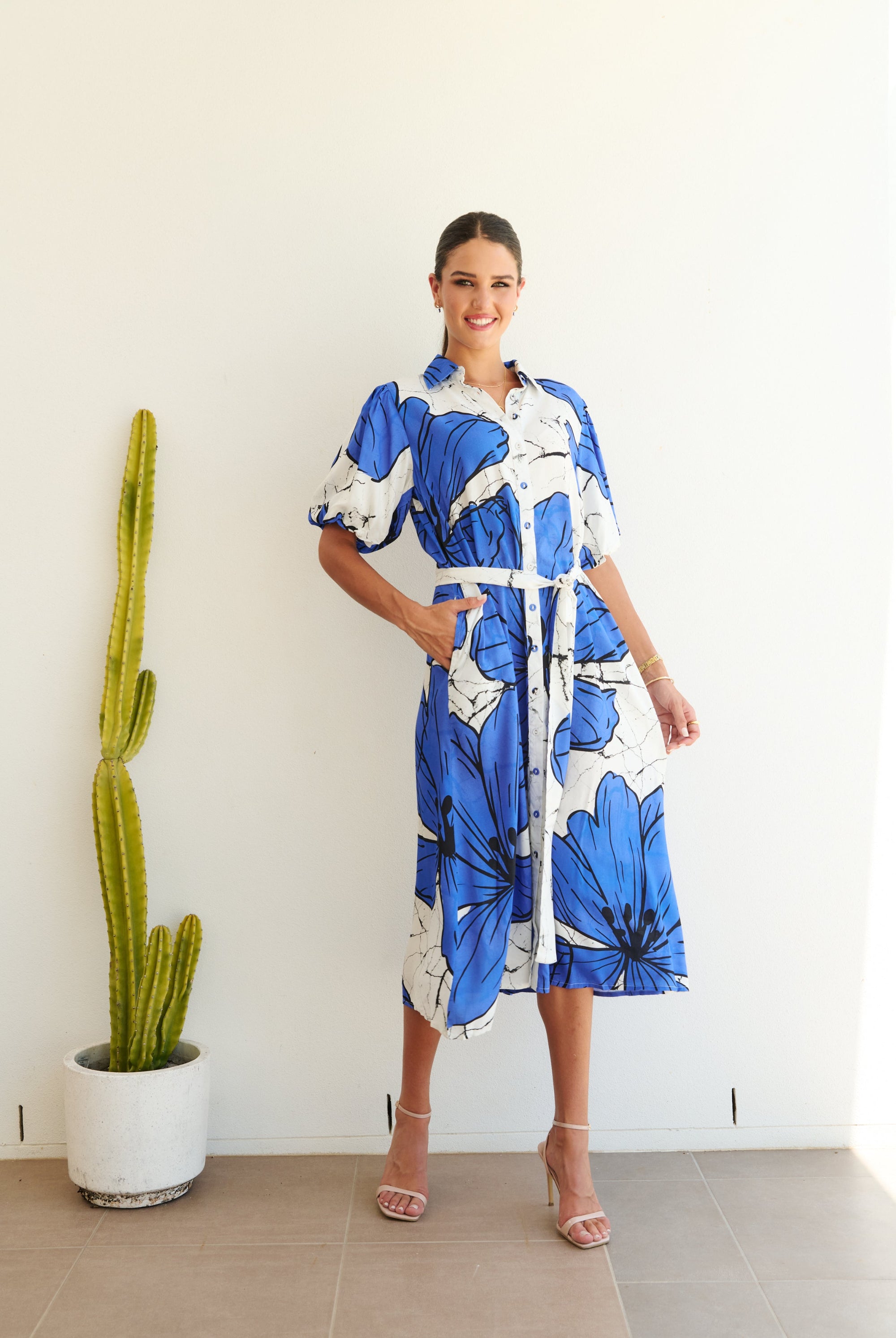 white blue large floral midi dress worn by model