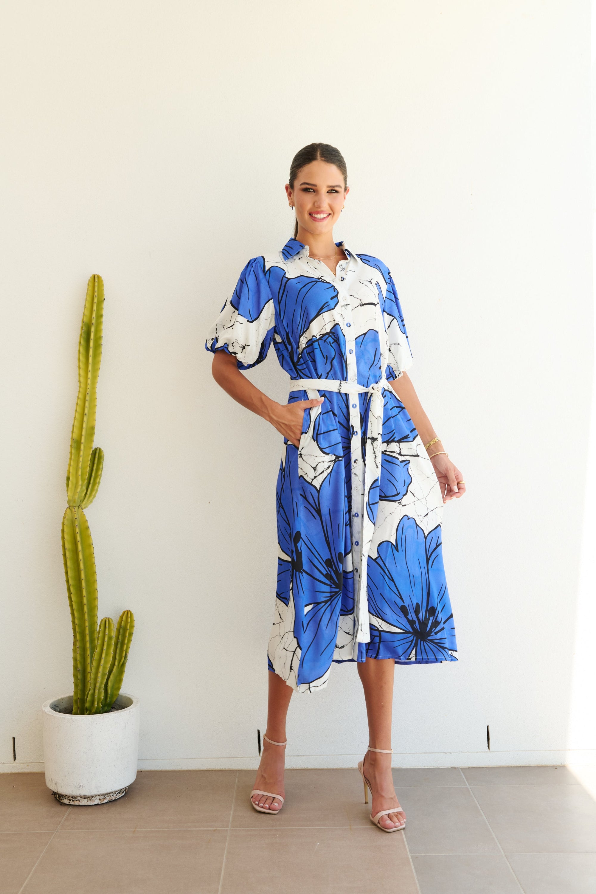 white blue large floral midi dress worn by model