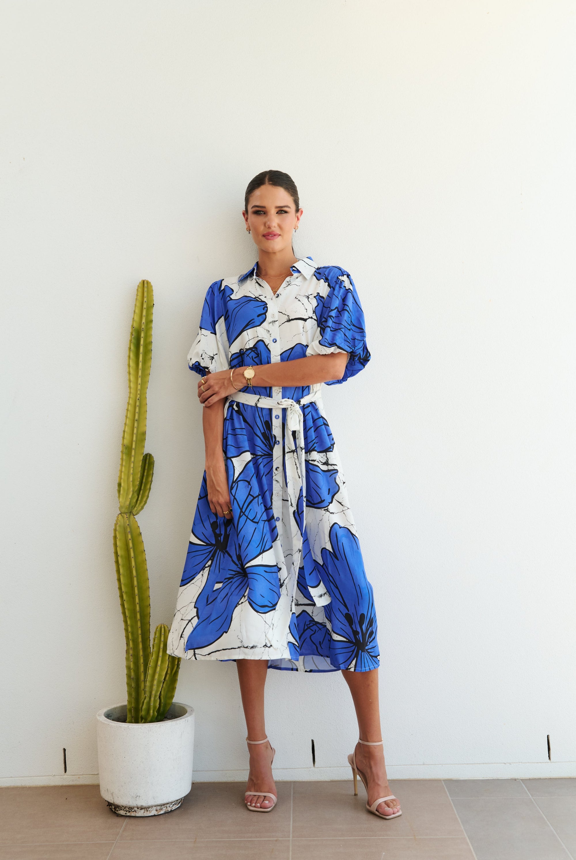 white blue large floral midi dress worn by model
