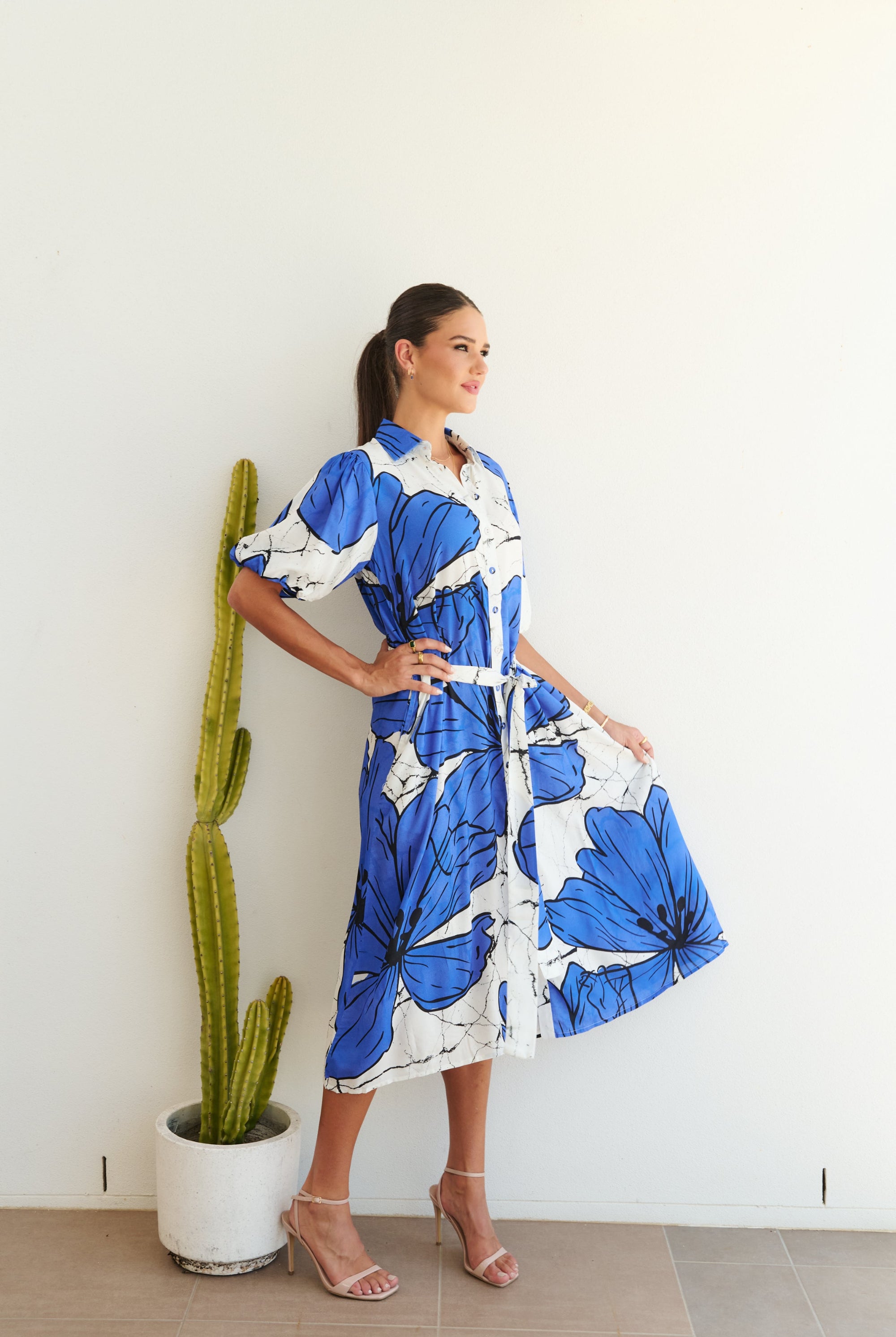 white blue large floral midi dress worn by model side view