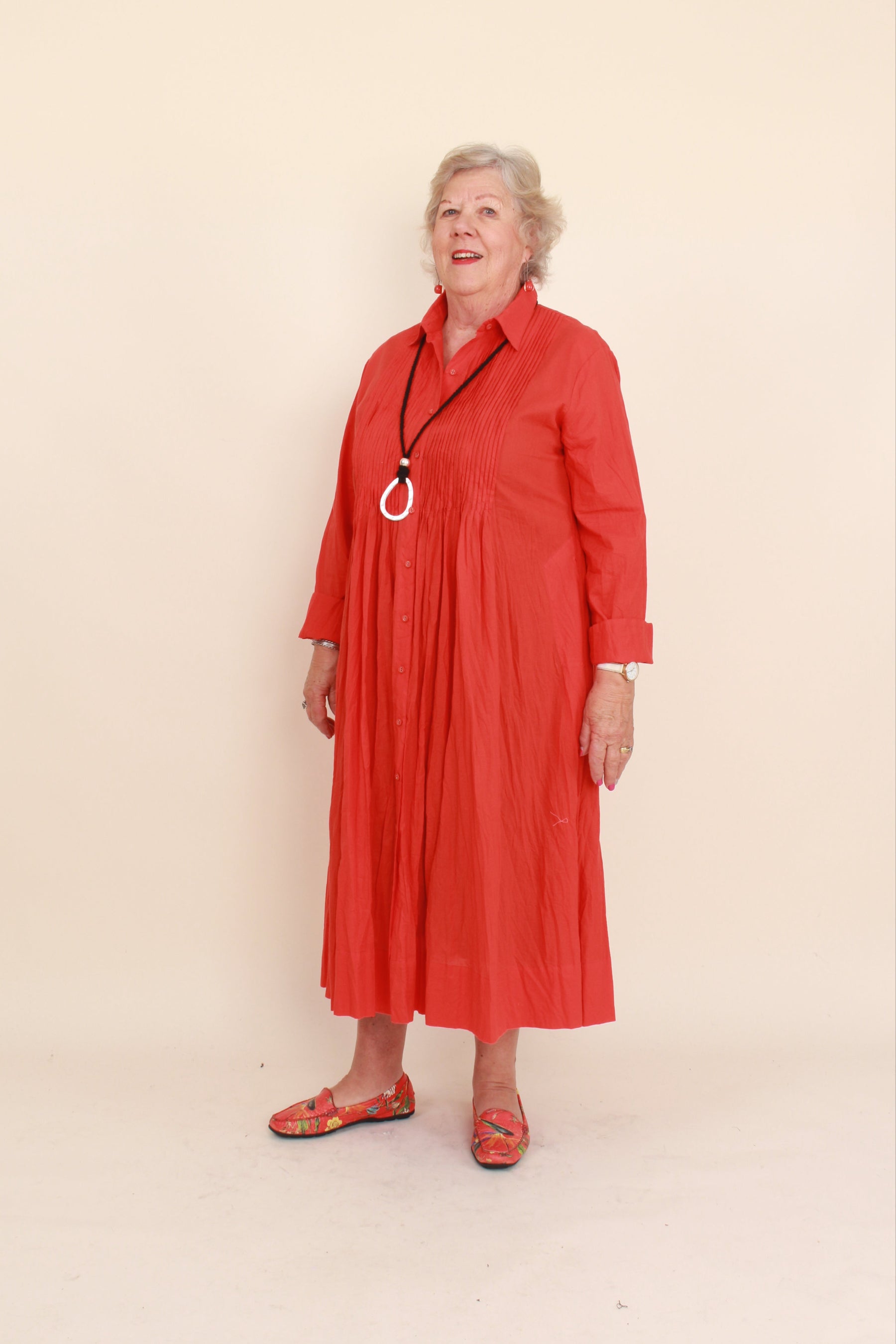 women wearing a red dress on a plain background