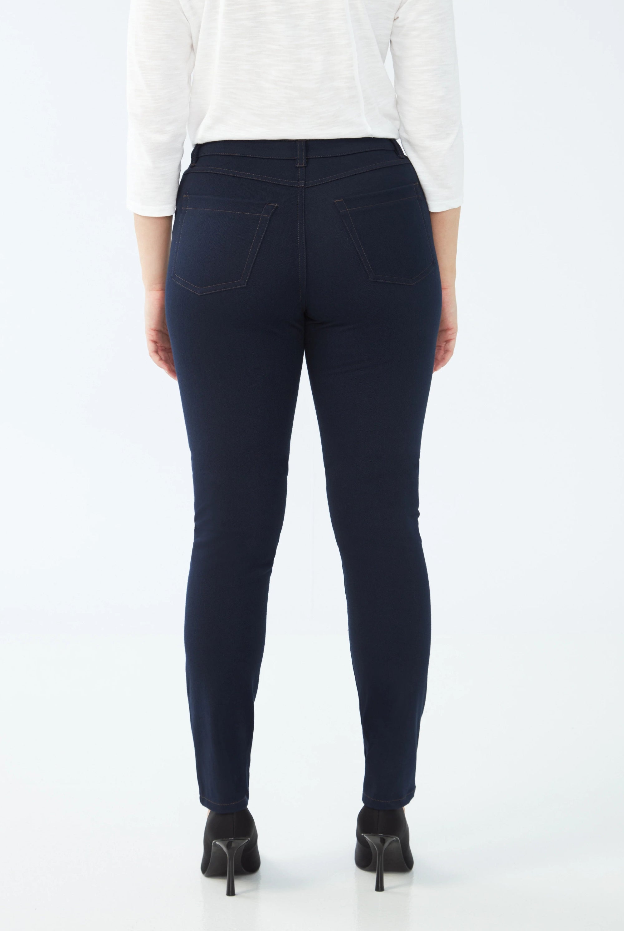 dark wash slim jean worn by model back view