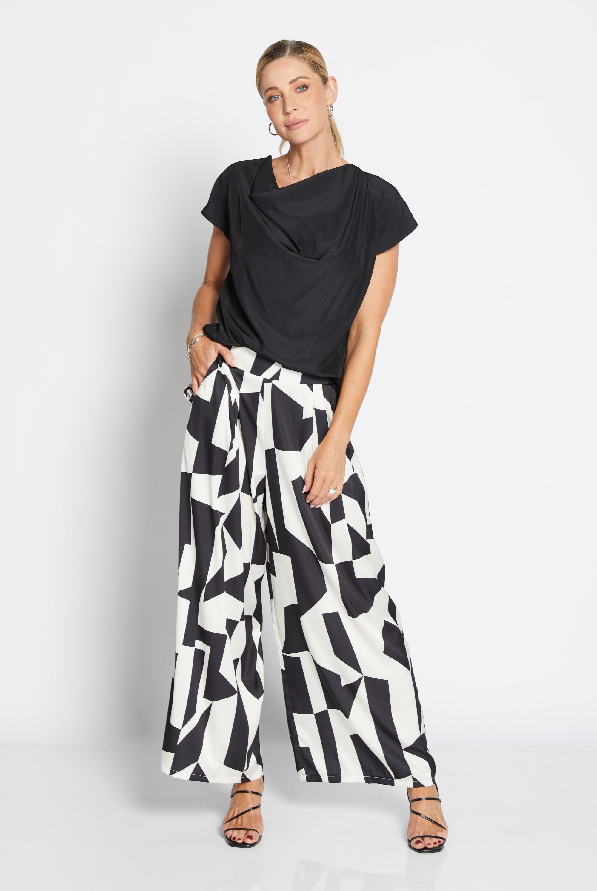 Womens wide leg black white geometric pant with black top worn by model