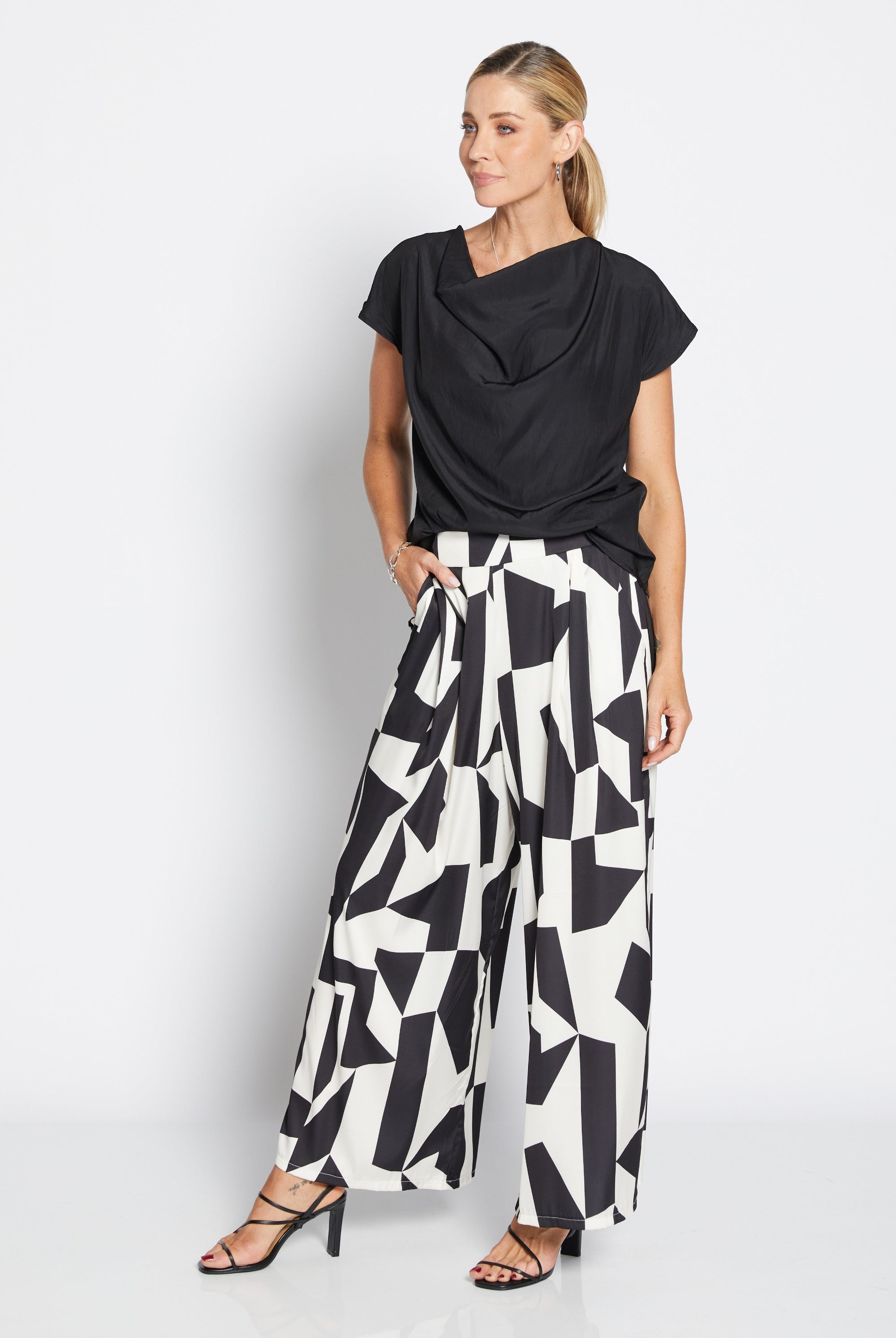 Womens wide leg black white geometric pant with black top worn by model