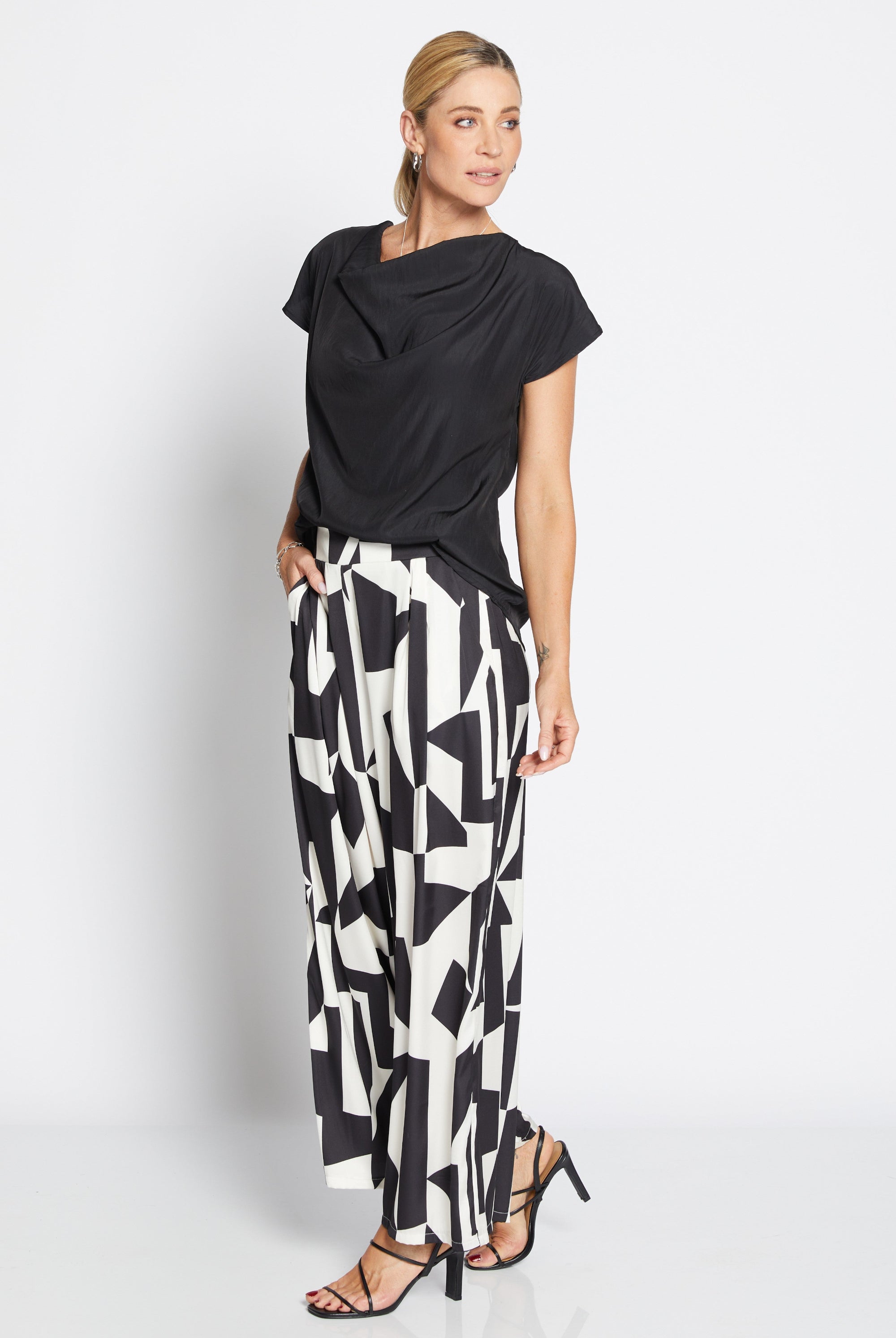 Womens wide leg black white geometric pant with black top worn by model