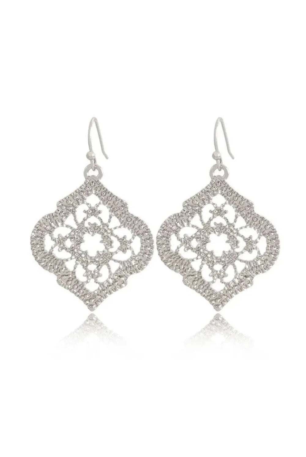silver earrings with moroccon design clear cut white background