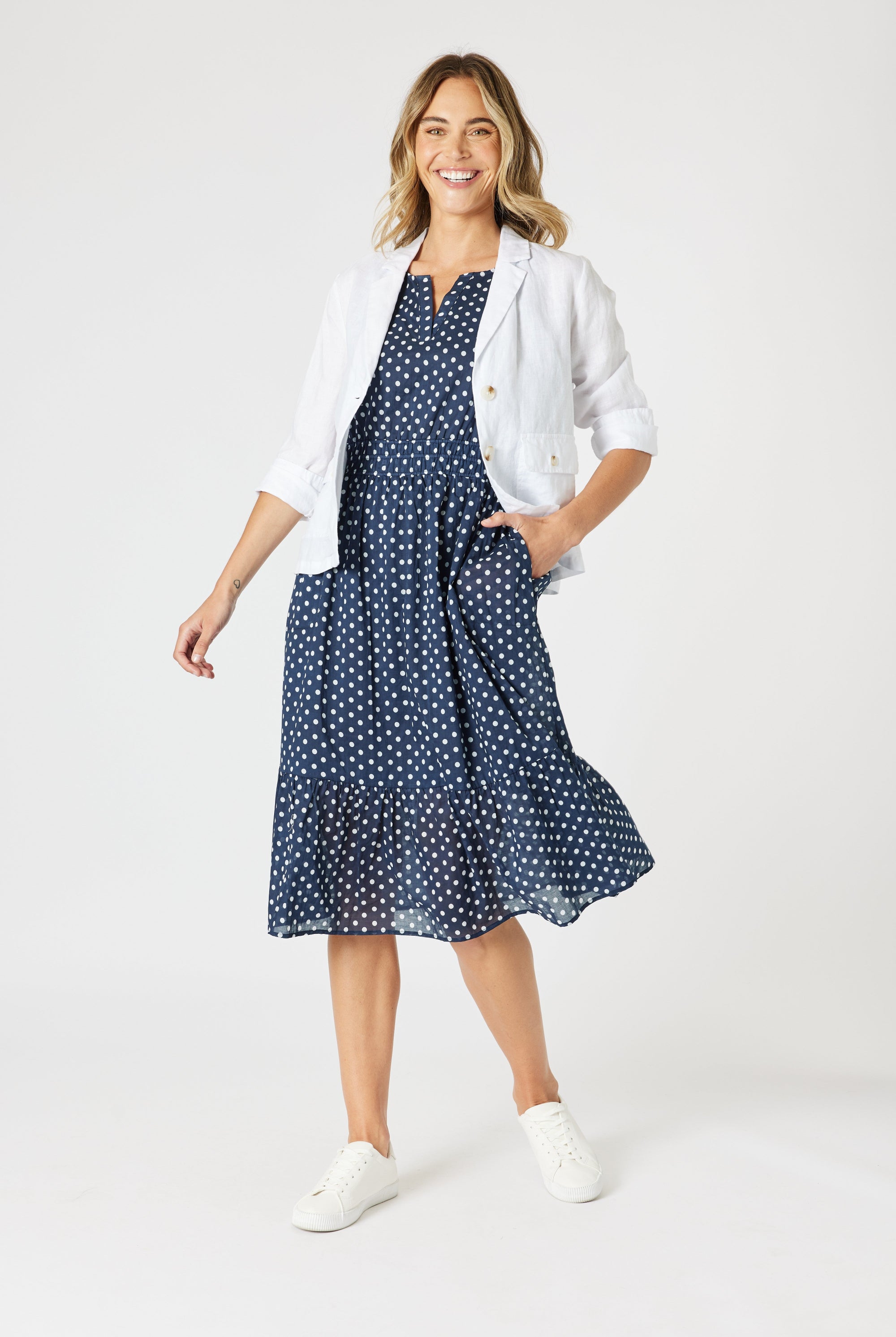 boxy linen blazer in white with polka dot dress worn by model
