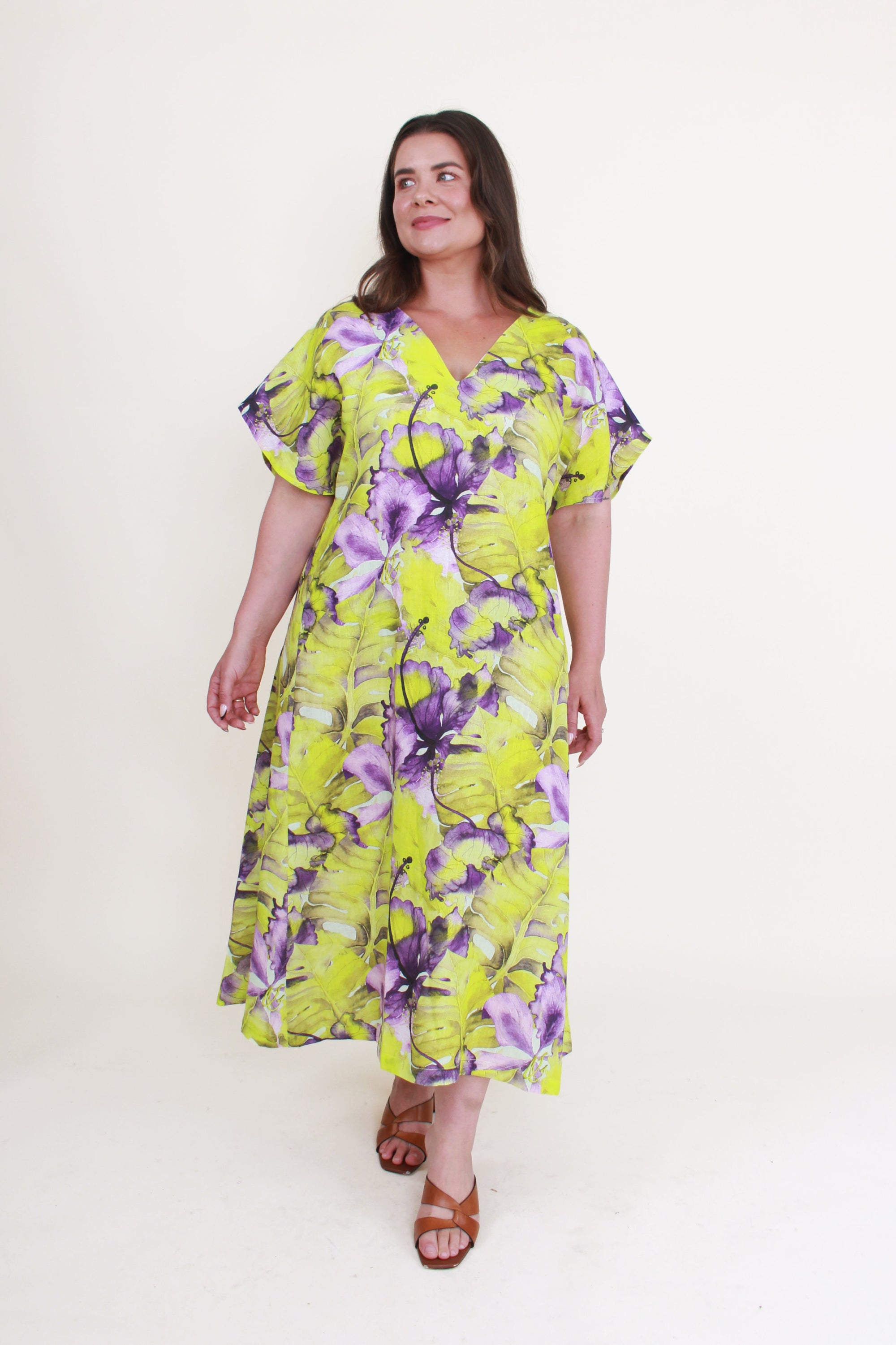 Woman wearing a floral dress with a white background
