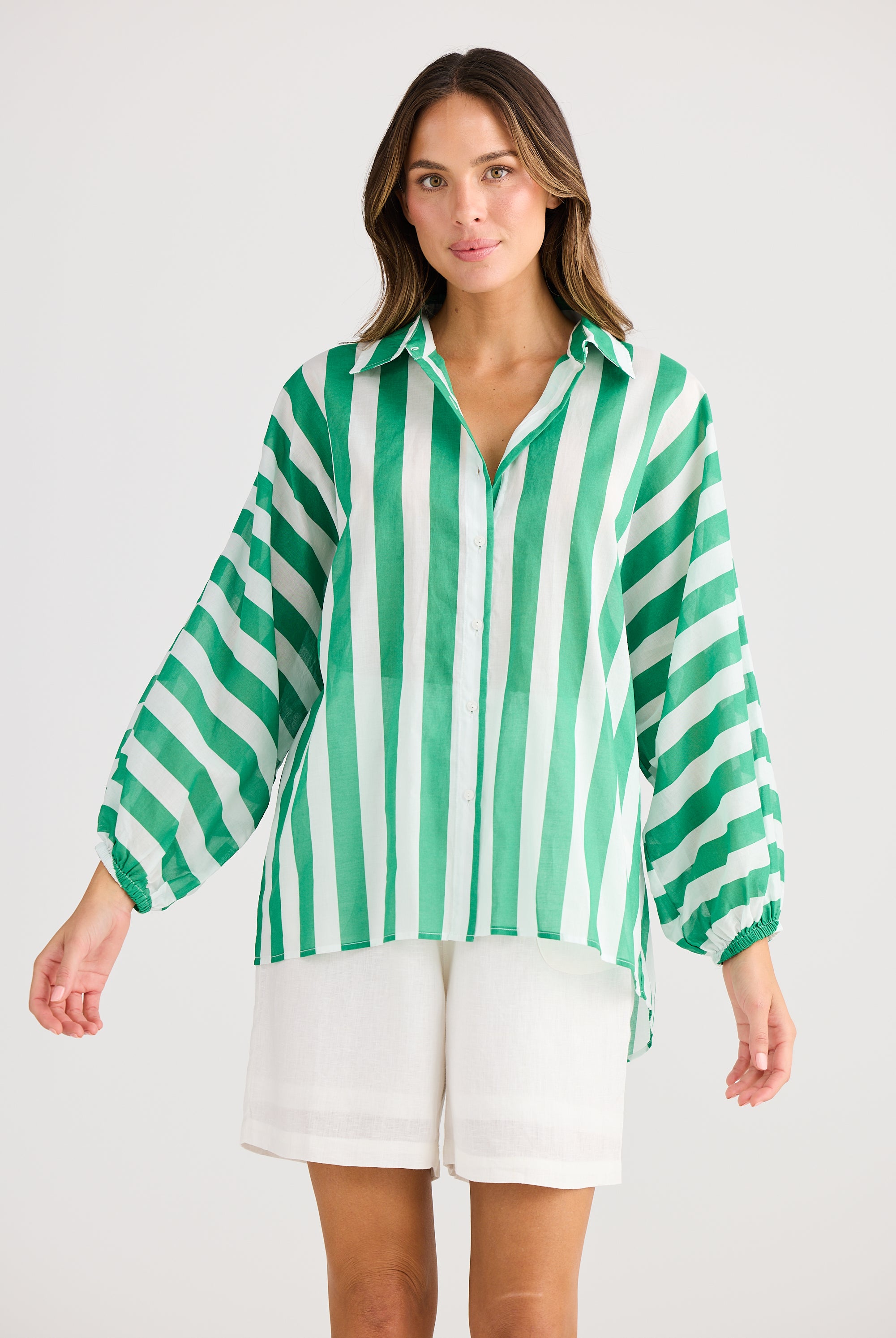 green and white vertical stripe shirt worn by model