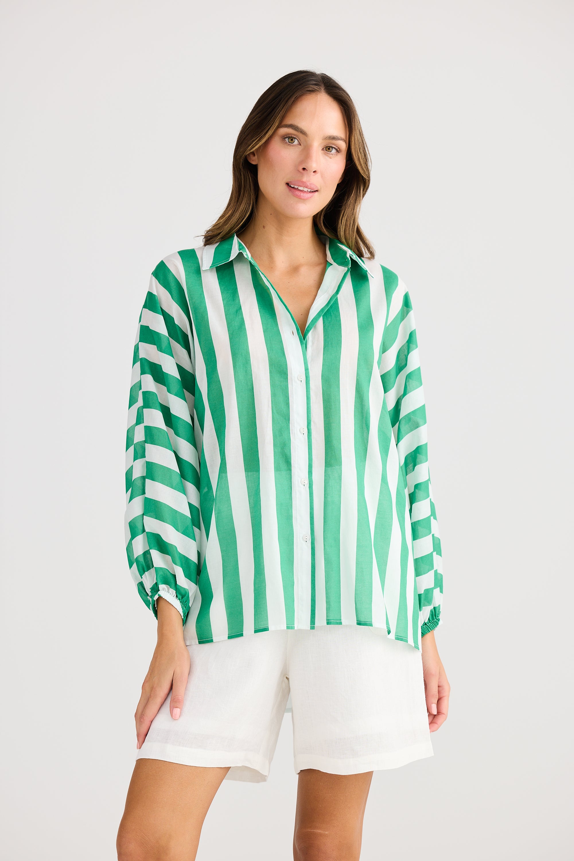 green and white vertical stripe shirt worn by model