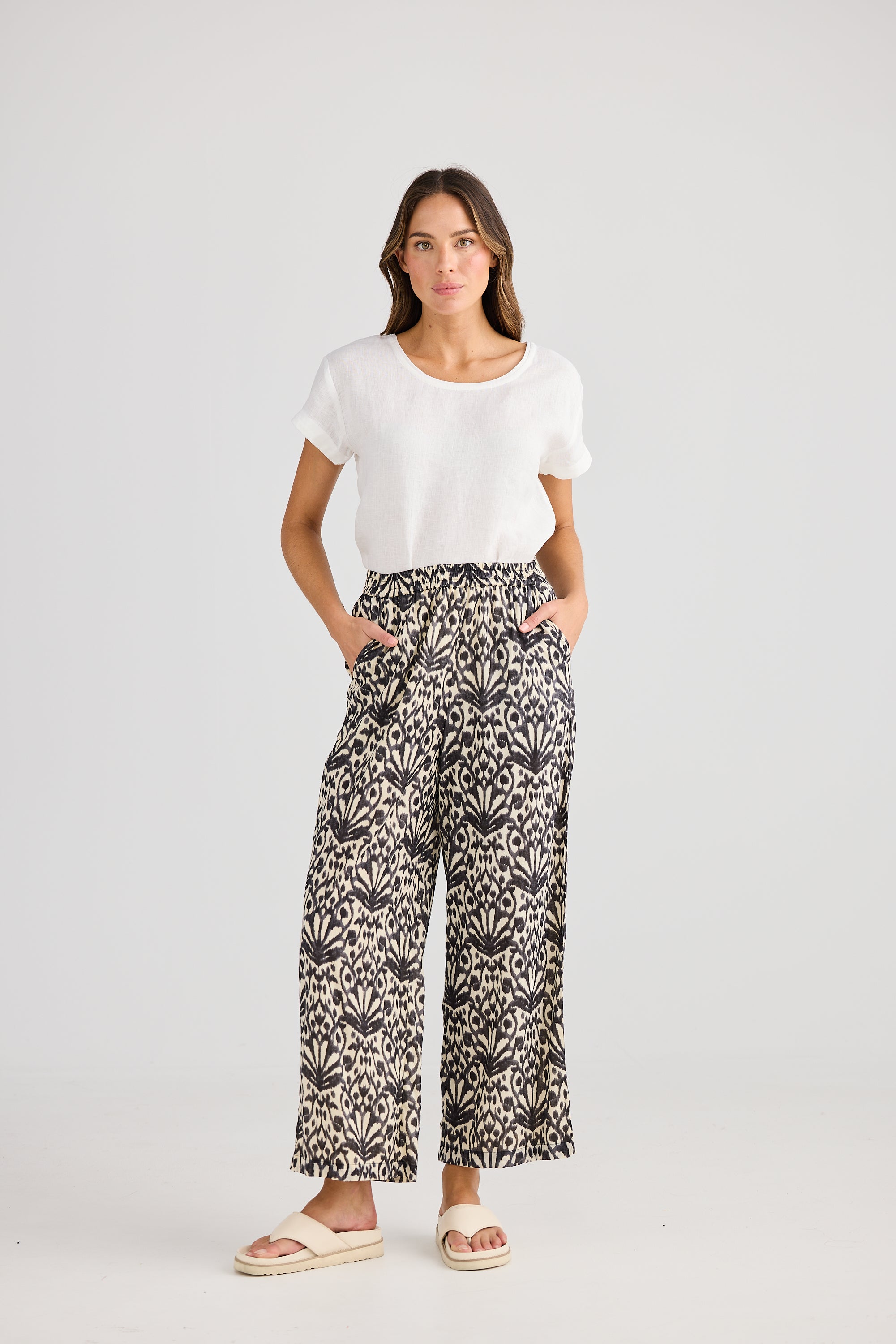 Wide leg pant cream and black fan print and white tee worn by model