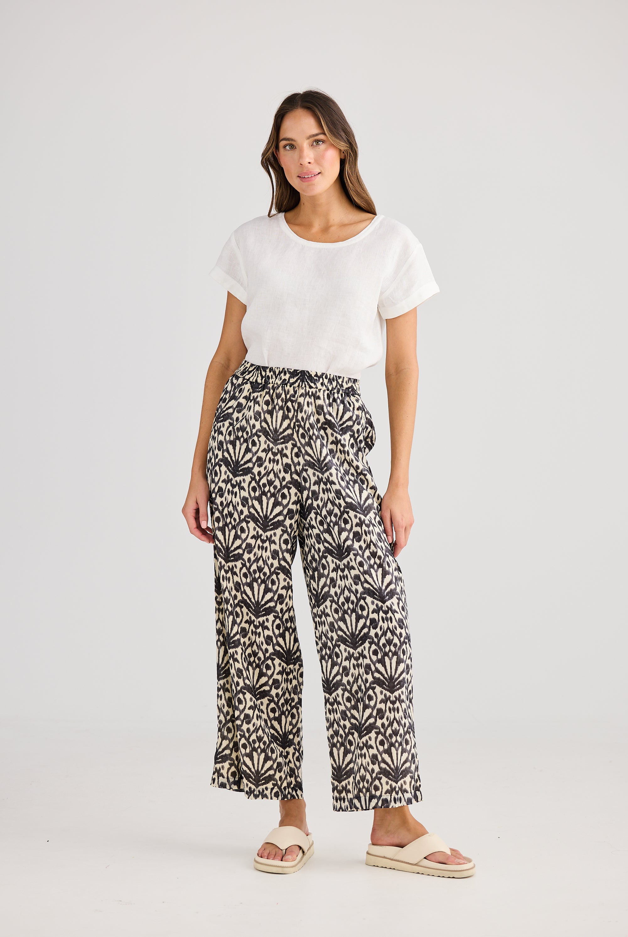 Wide leg pant cream and black fan print and white tee worn by model