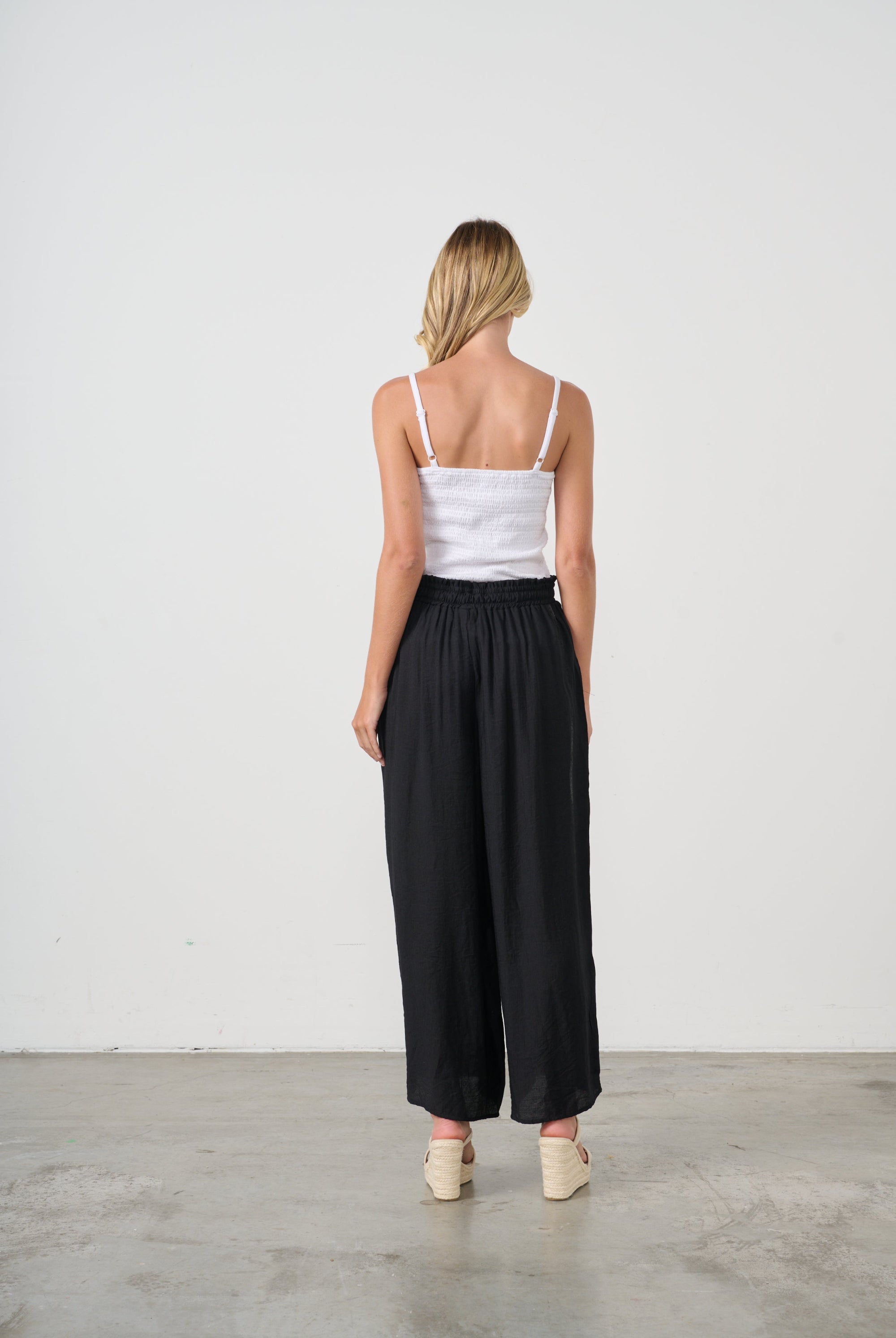 womens wide leg black pants with drawstring worn by model back view