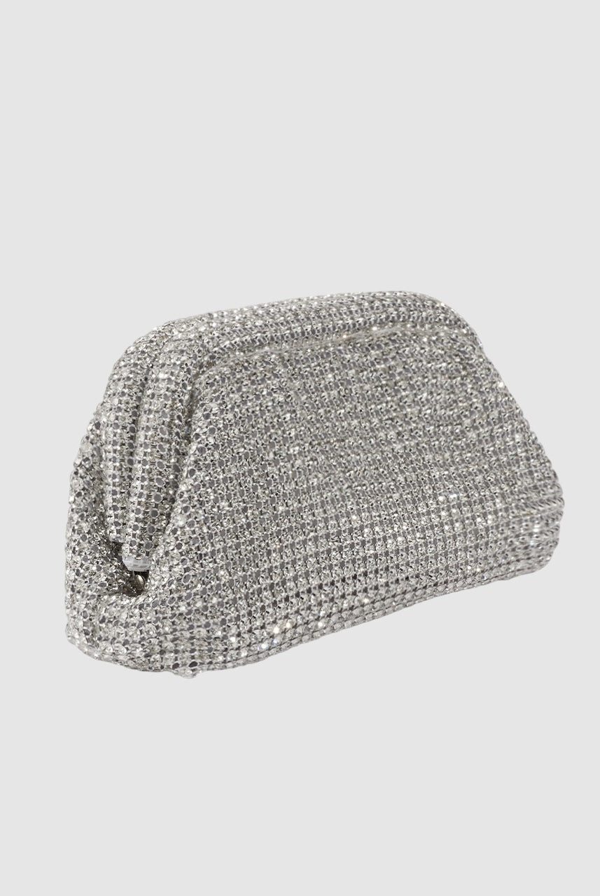 Silver clutch bag with rhinestone embellishments on a light gray background