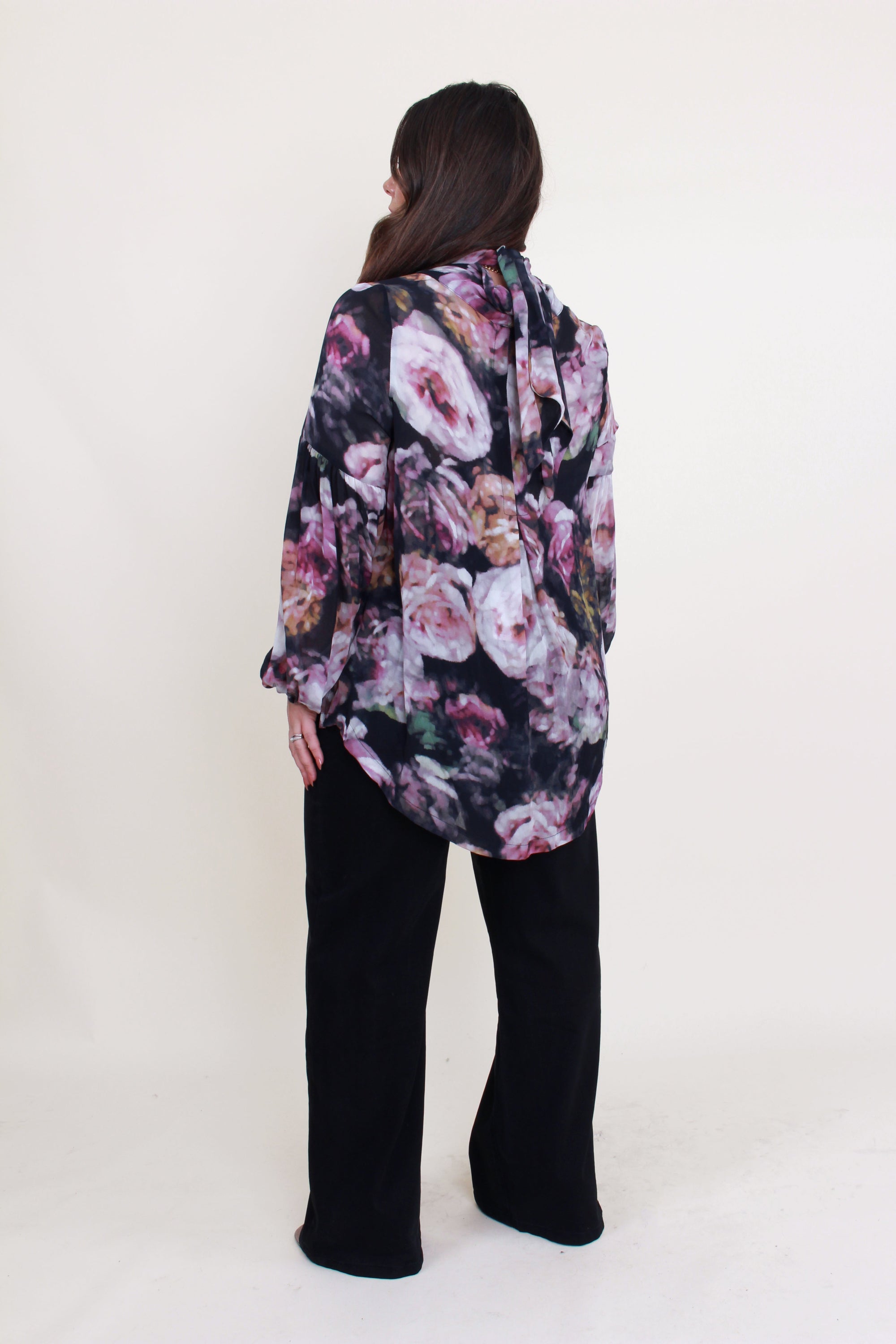 womens floral blouse with neck tie worn by model back view