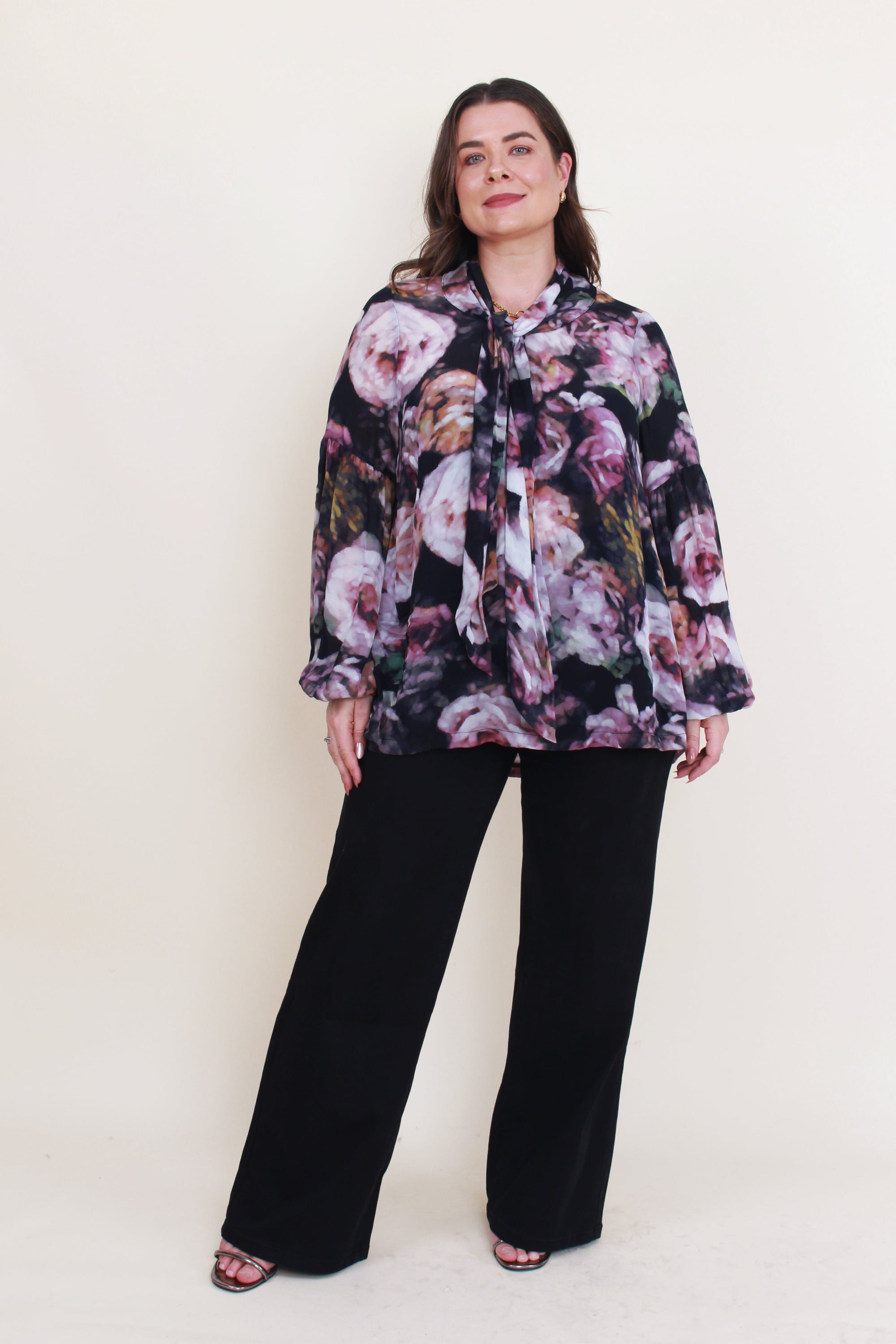 womens floral blouse with neck tie worn by model