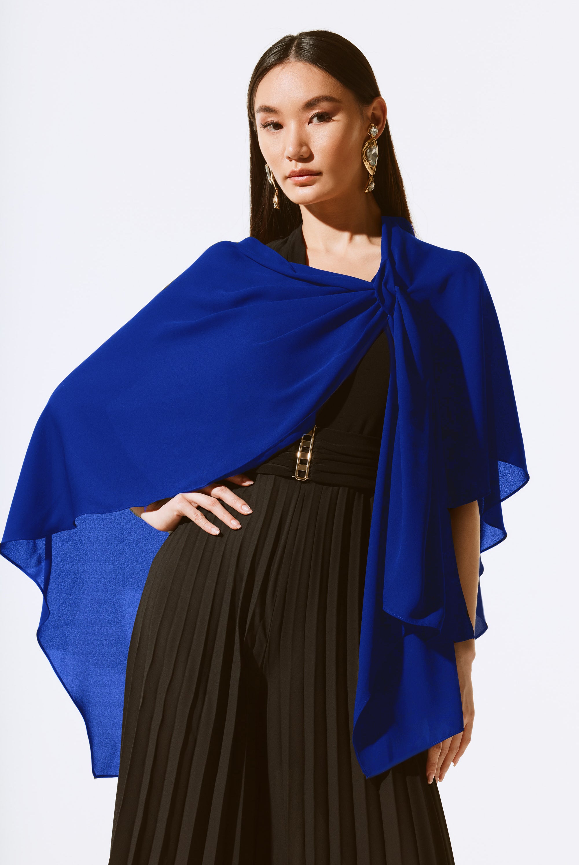royal blue ciffon cover up worn by model over black outfit