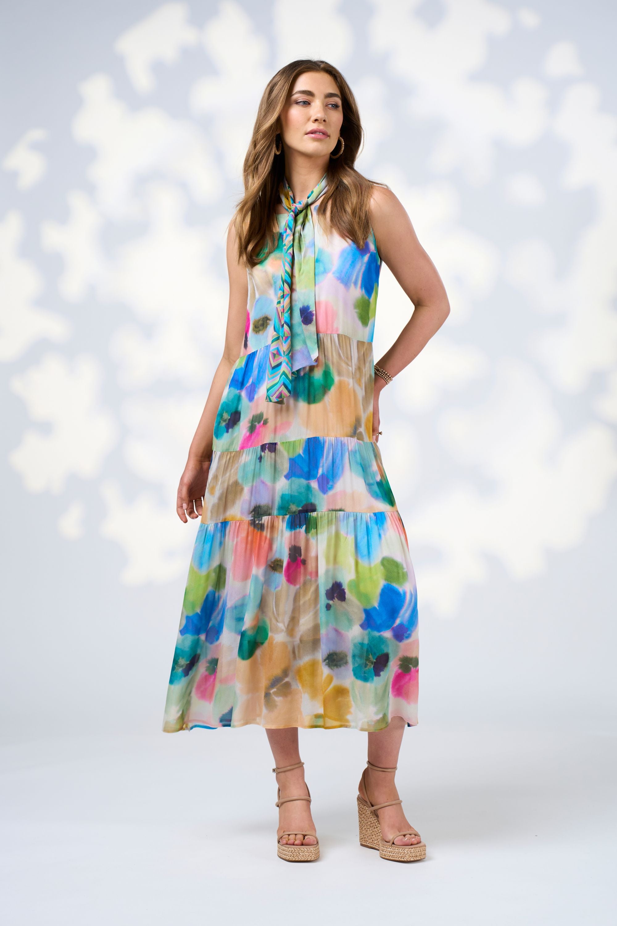 watercolour floral tiered sleeveless midi dress worn by model