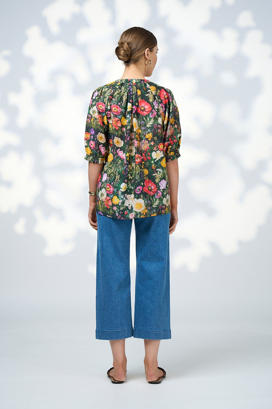 floral wild flower print blouse and jeans worn by model