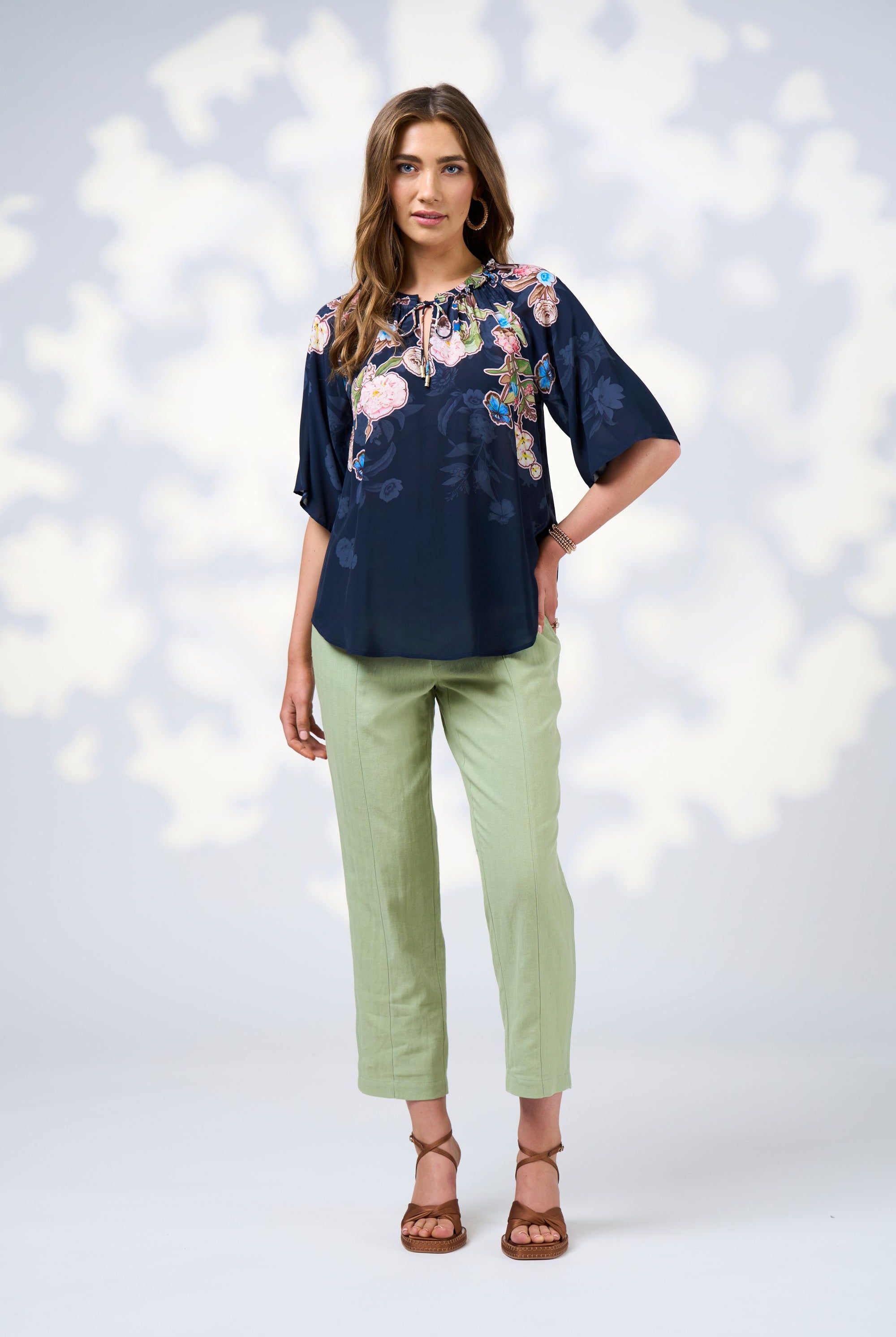womens blouse with floral design in indigo worn by model