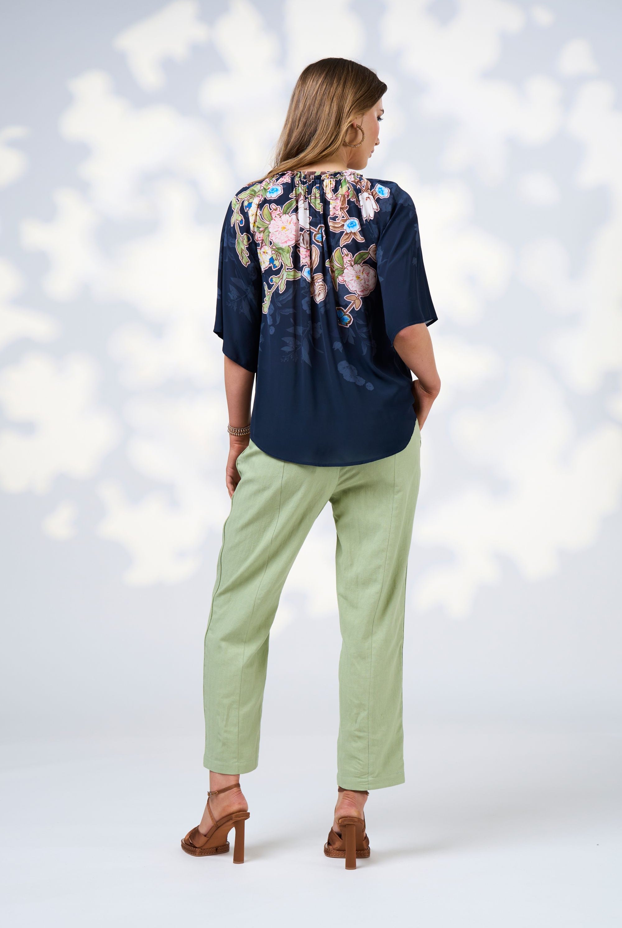 womens blouse with floral design in indigo worn by model back view