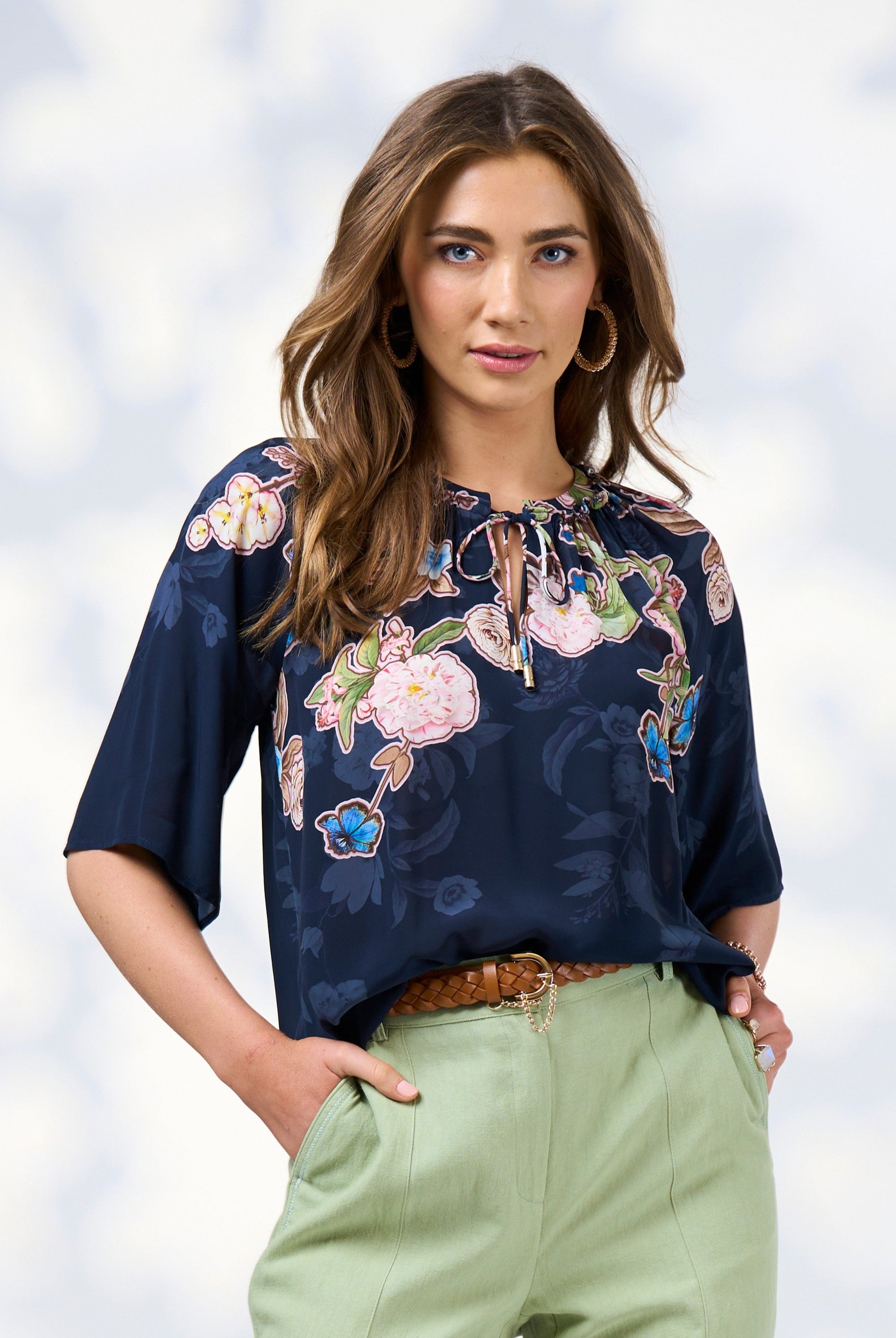 womens blouse with floral design in indigo worn by model