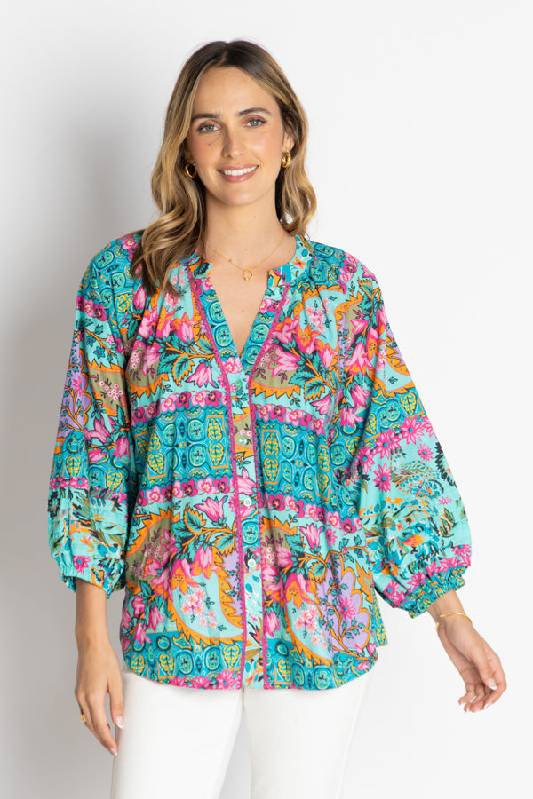 model wearing multi colour button through shirt