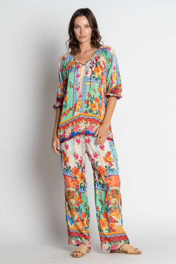 floral geometric multi colour blouse and pants worn by model