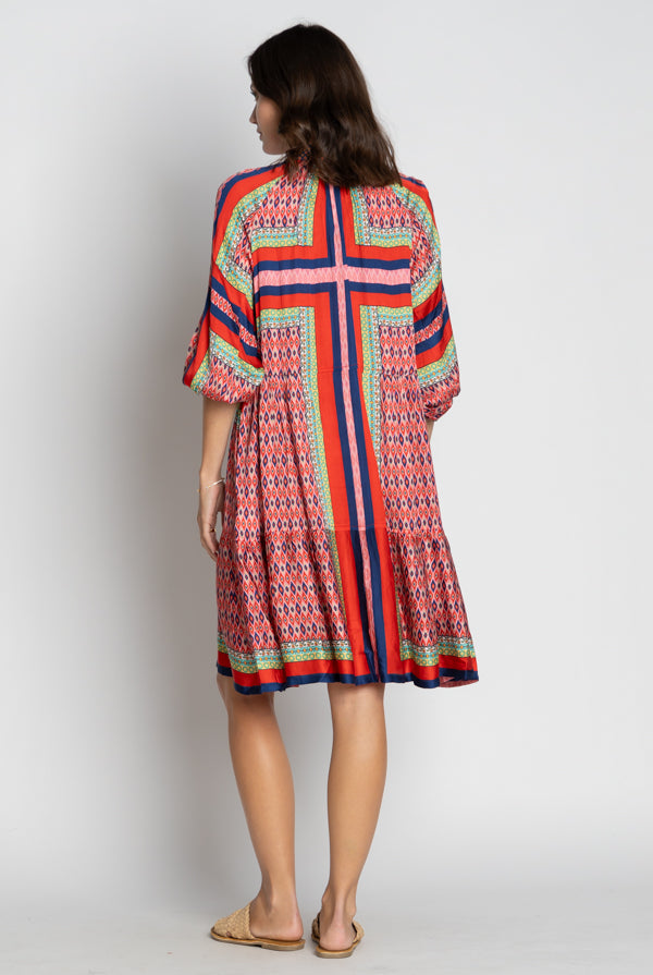 womens midi dress with multi colour geometric print worn by model back view