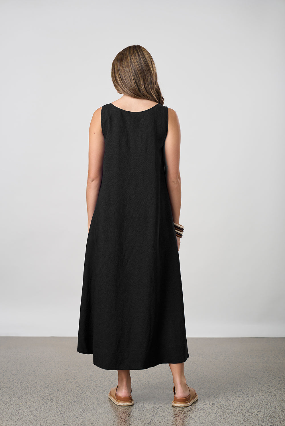 pleat maxi dress black worn by model back view