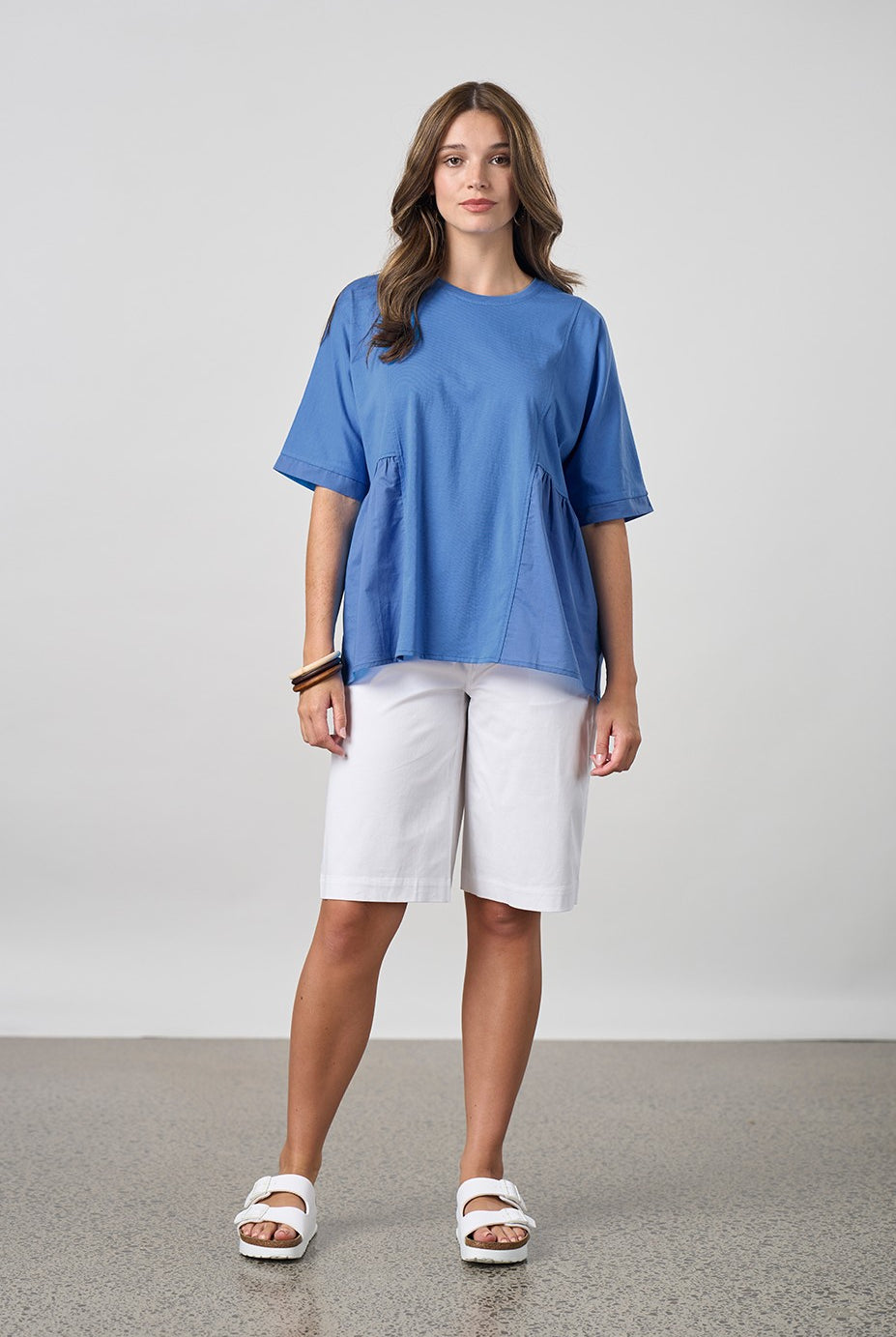 blue shirt with white short worn by model