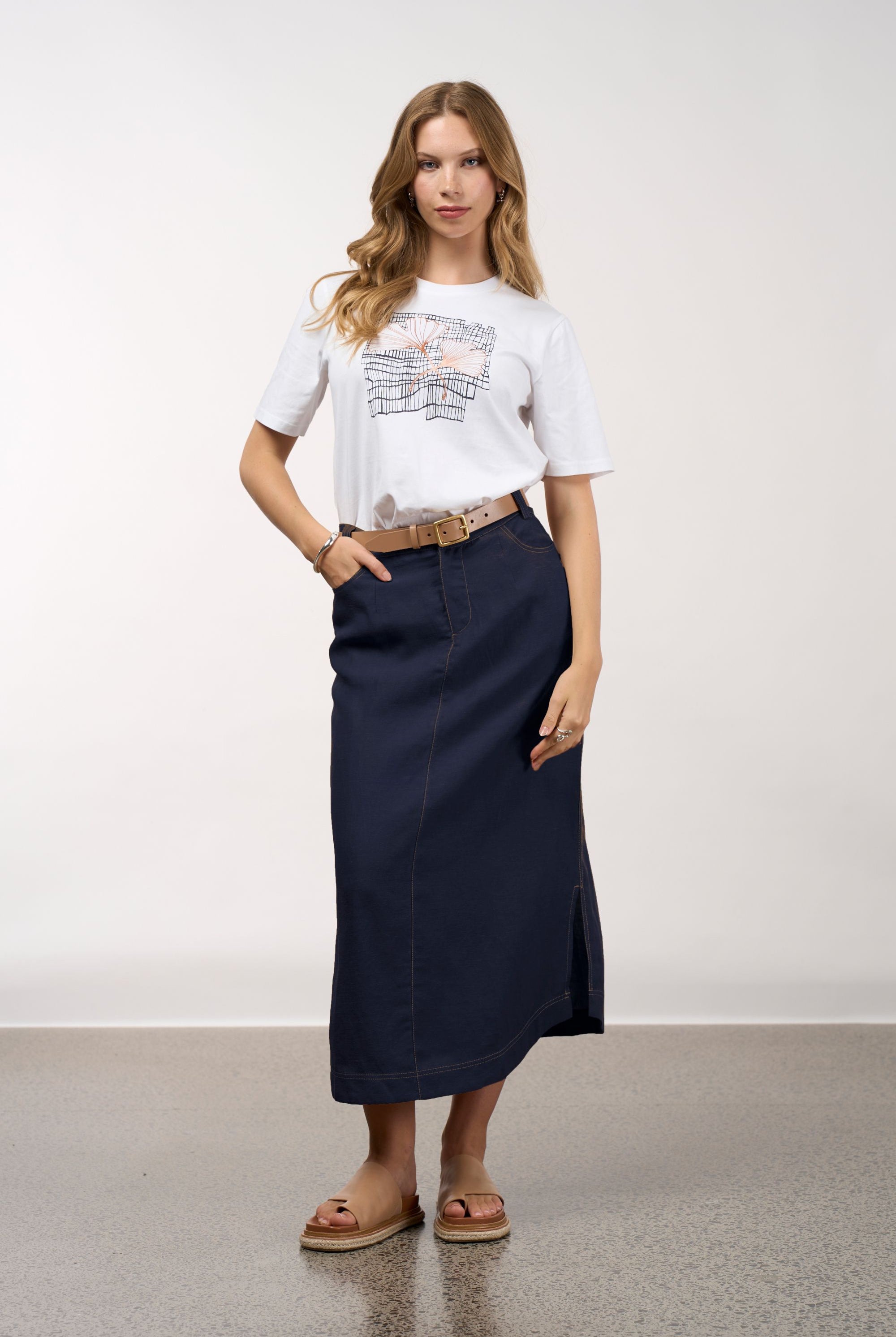 womens white tee with floral and grid line design worn by model