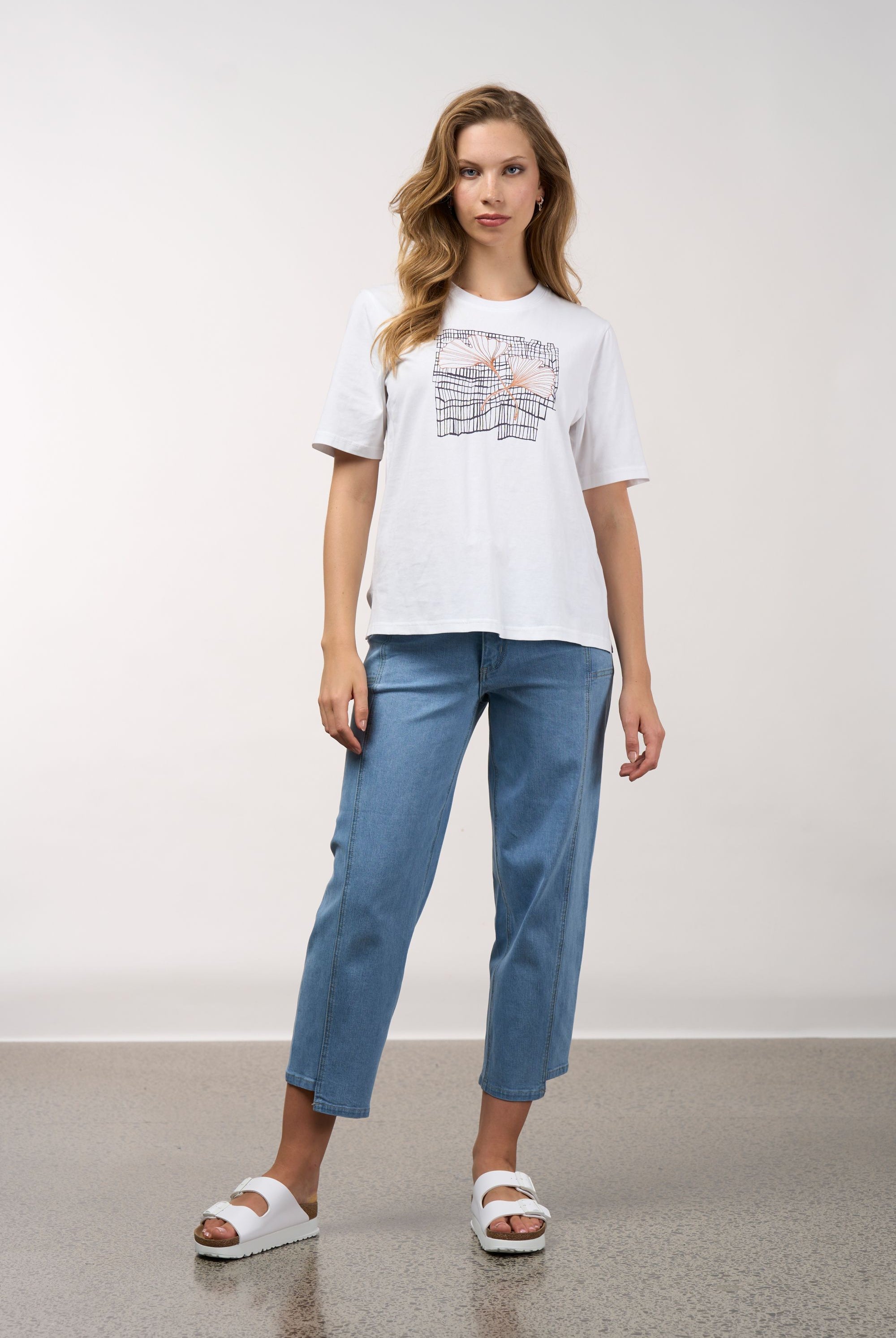 womens white tee with floral and grid line design worn by model