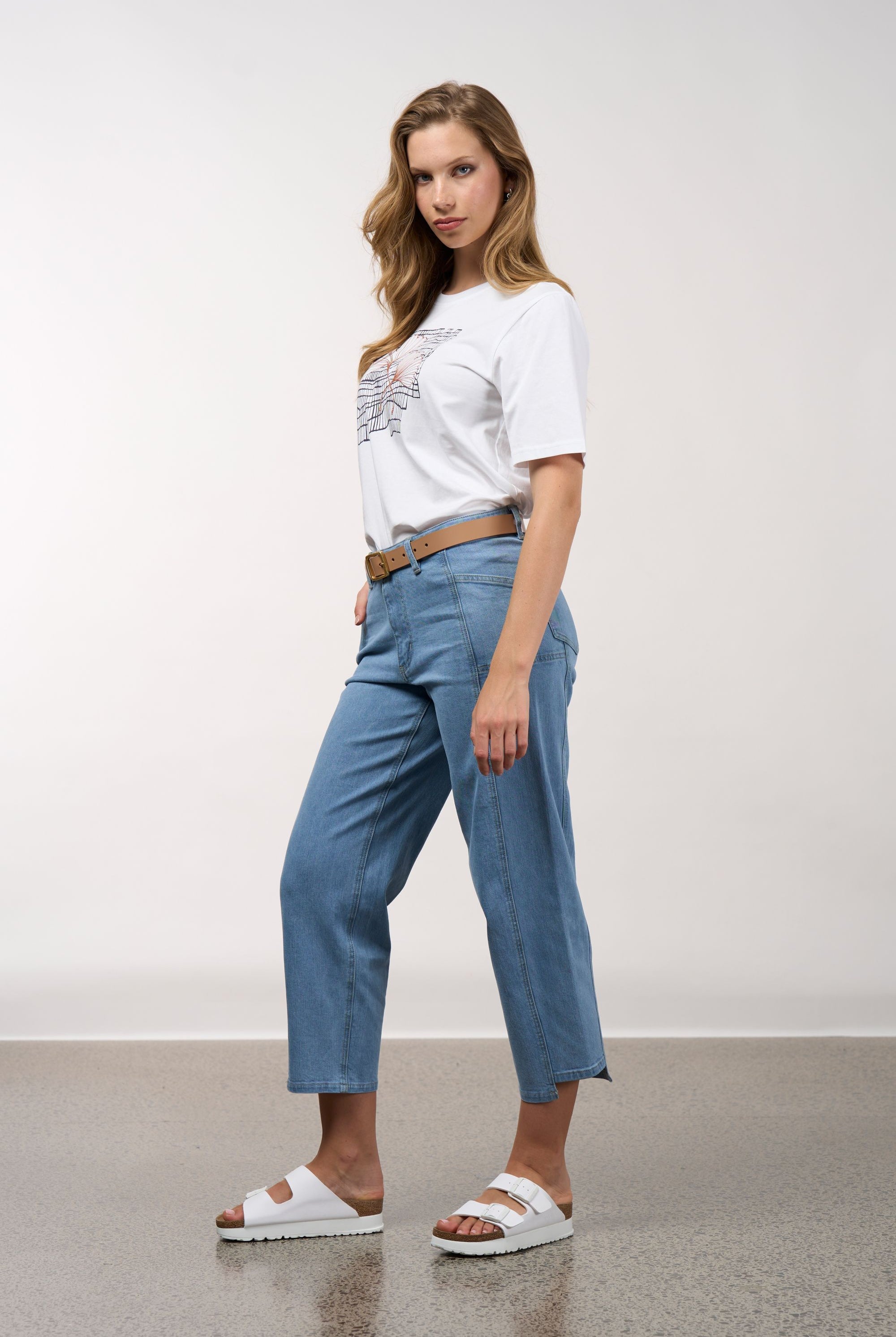 womens white tee with floral and grid line design worn by model side view